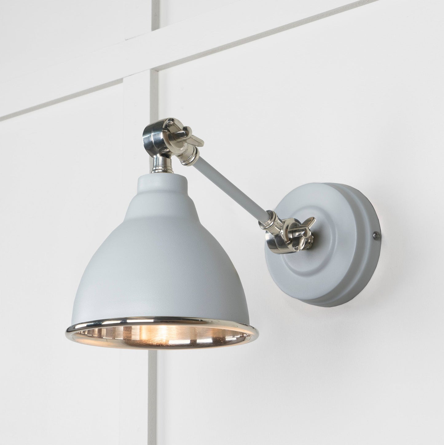Smooth Nickel Brindley Wall Light Birch, Front Side with light on.
