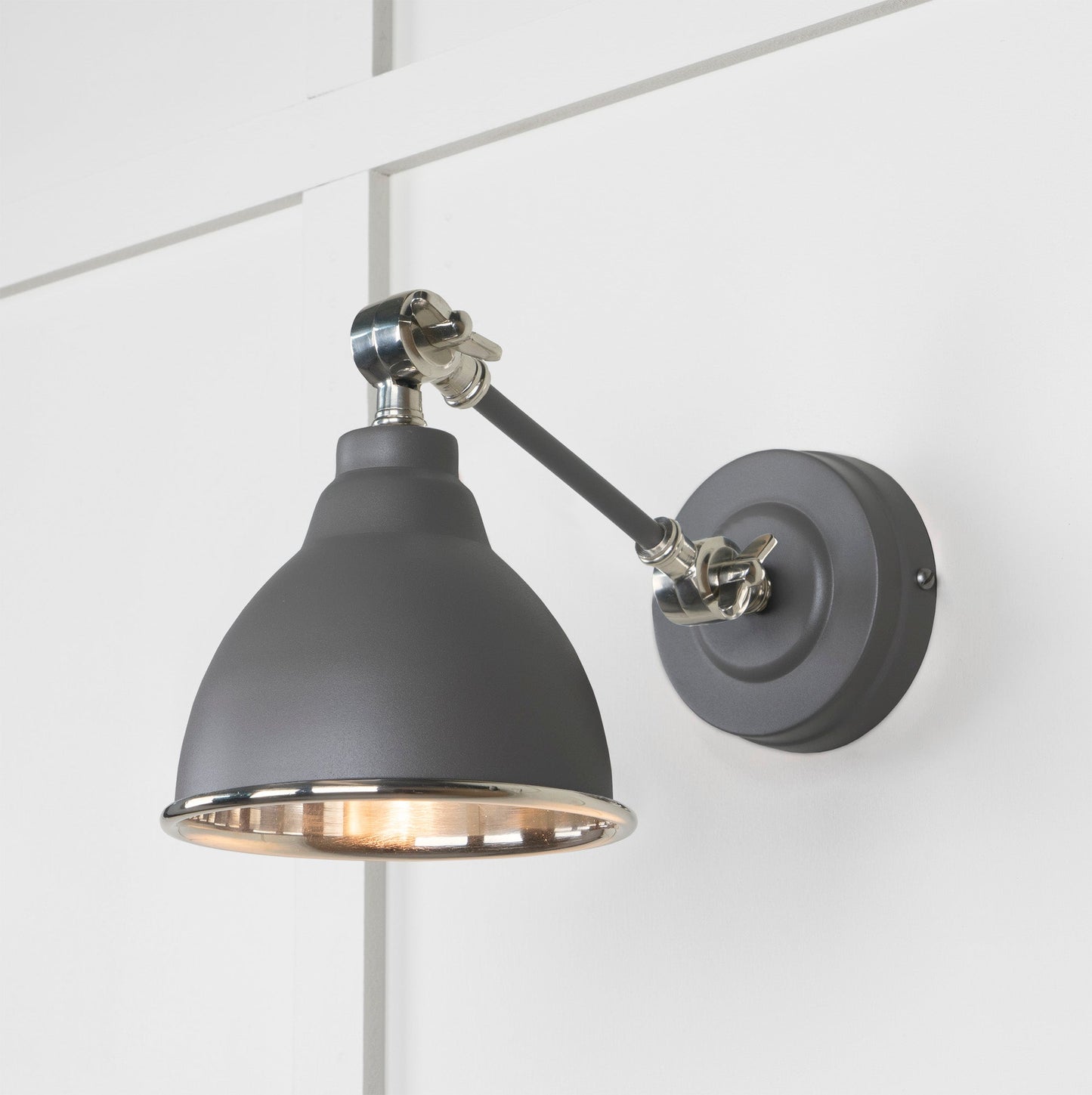 Smooth Nickel Brindley Wall Light Bluff, Front Side with light on.