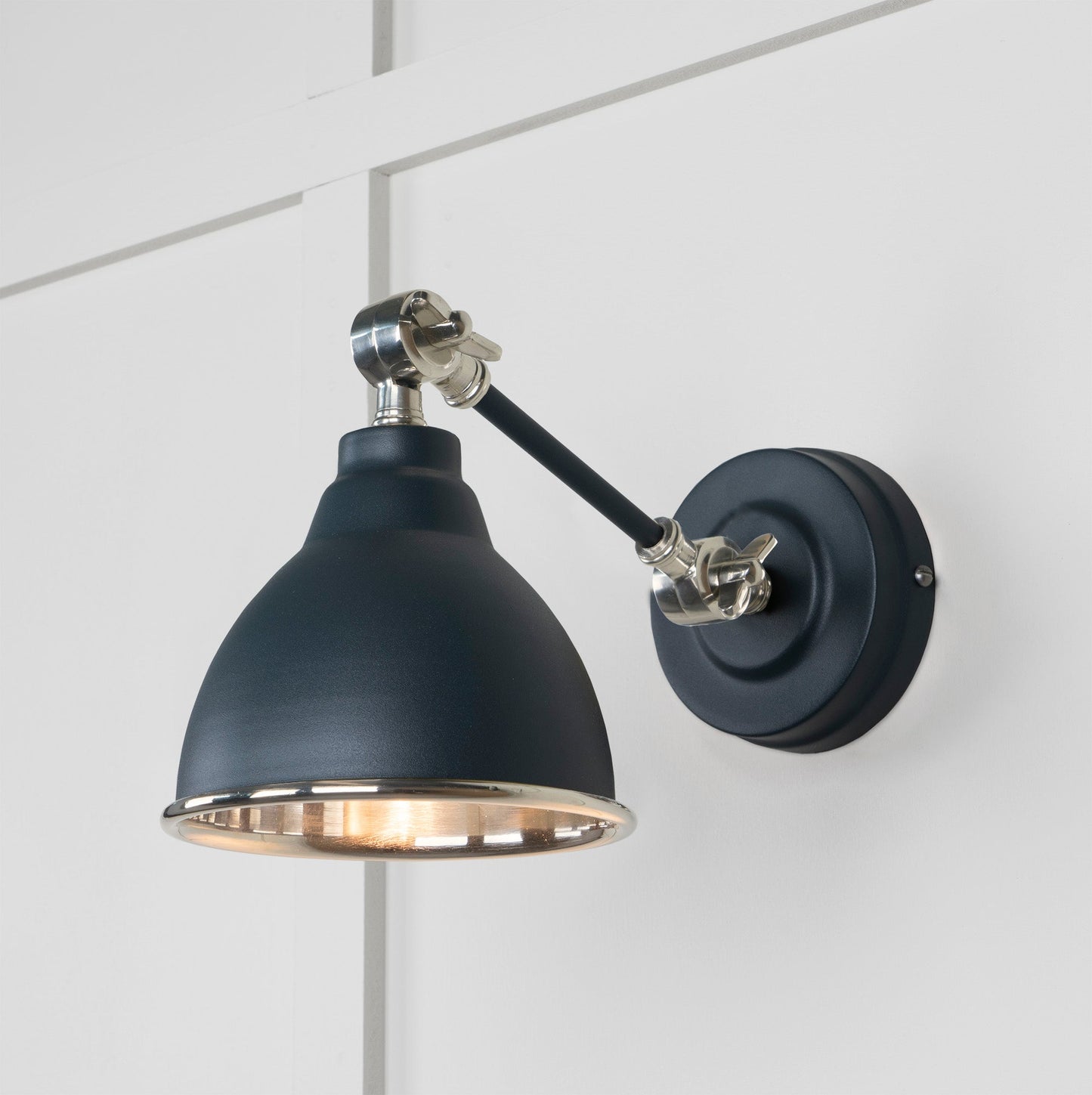 Smooth Nickel Brindley Wall Light Soot, Front Side with light on.