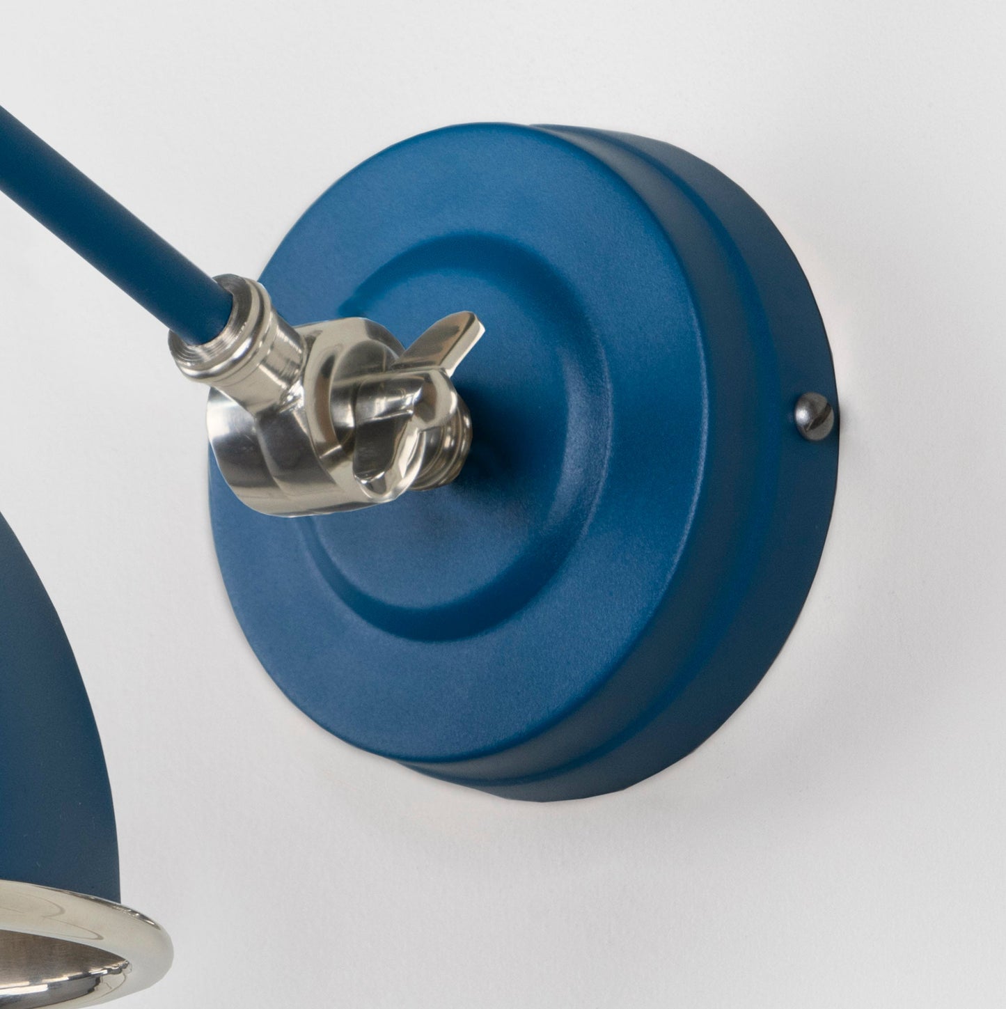 Smooth Nickel Brindley Wall Light Upstream, close up view of fitting and cable.