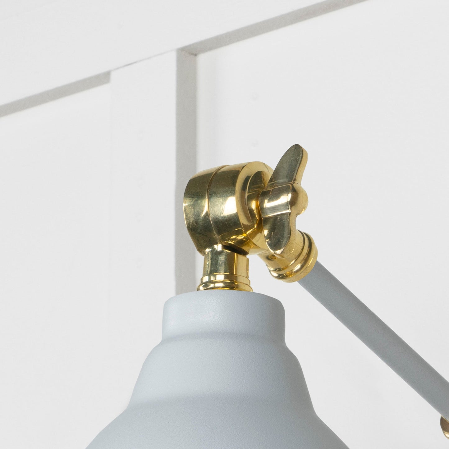 Smooth Brass Brindley Wall Light Birch, Detailed close up view of pendant.