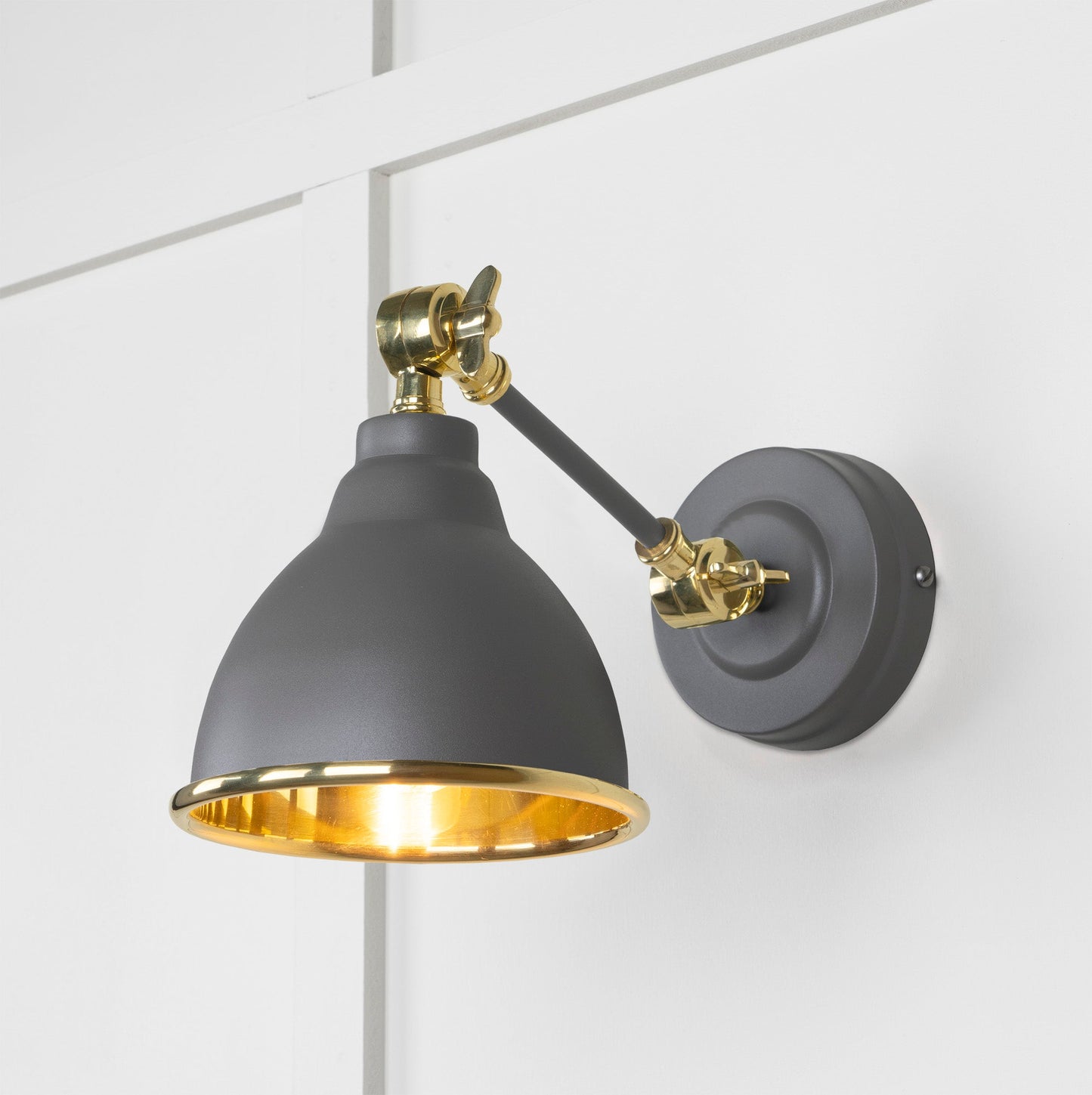 Smooth Brass Brindley Wall Light Bluff, Front Side with light on.