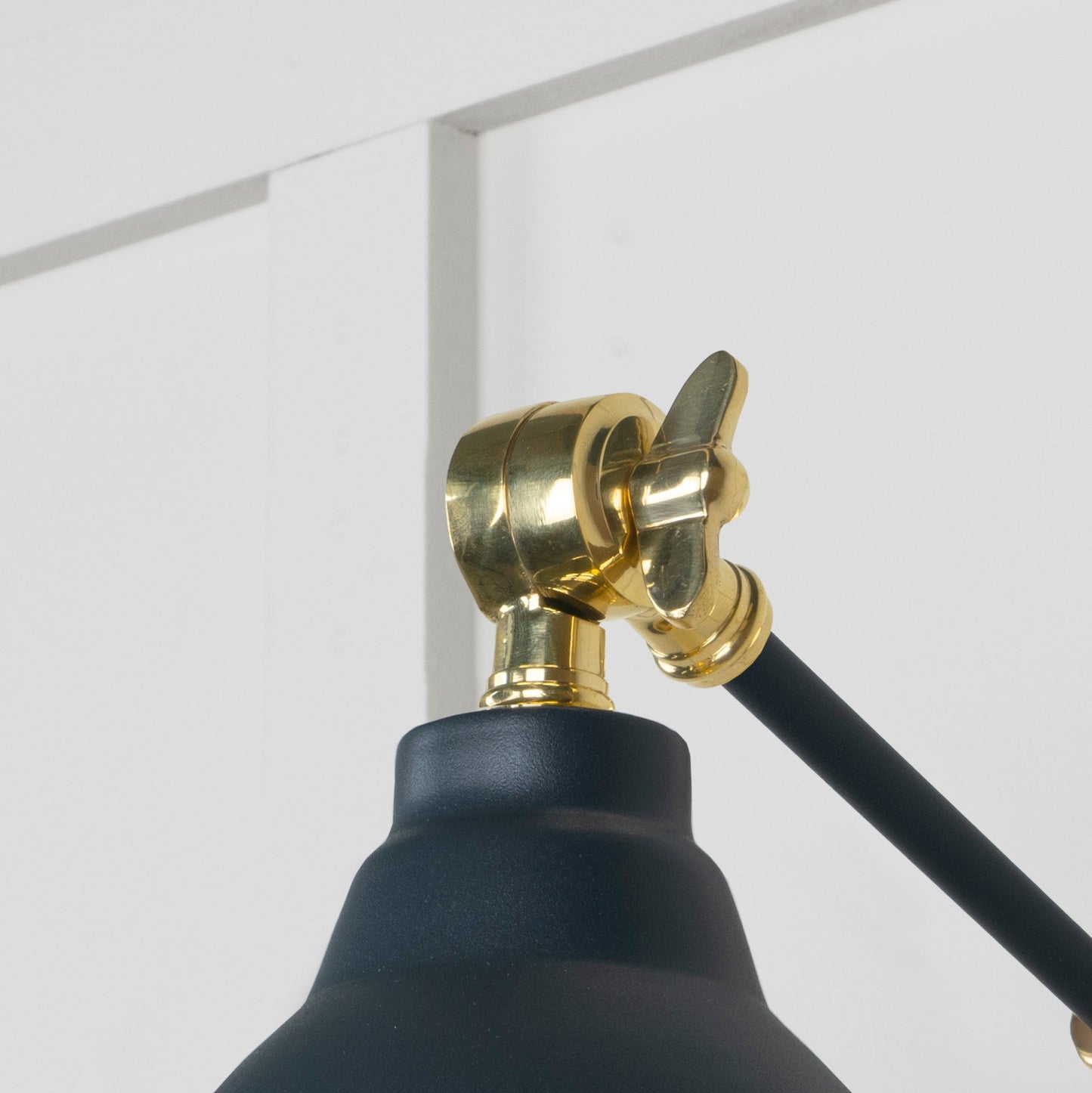 Smooth Brass Brindley Wall Light Soot, Detailed close up view of pendant.