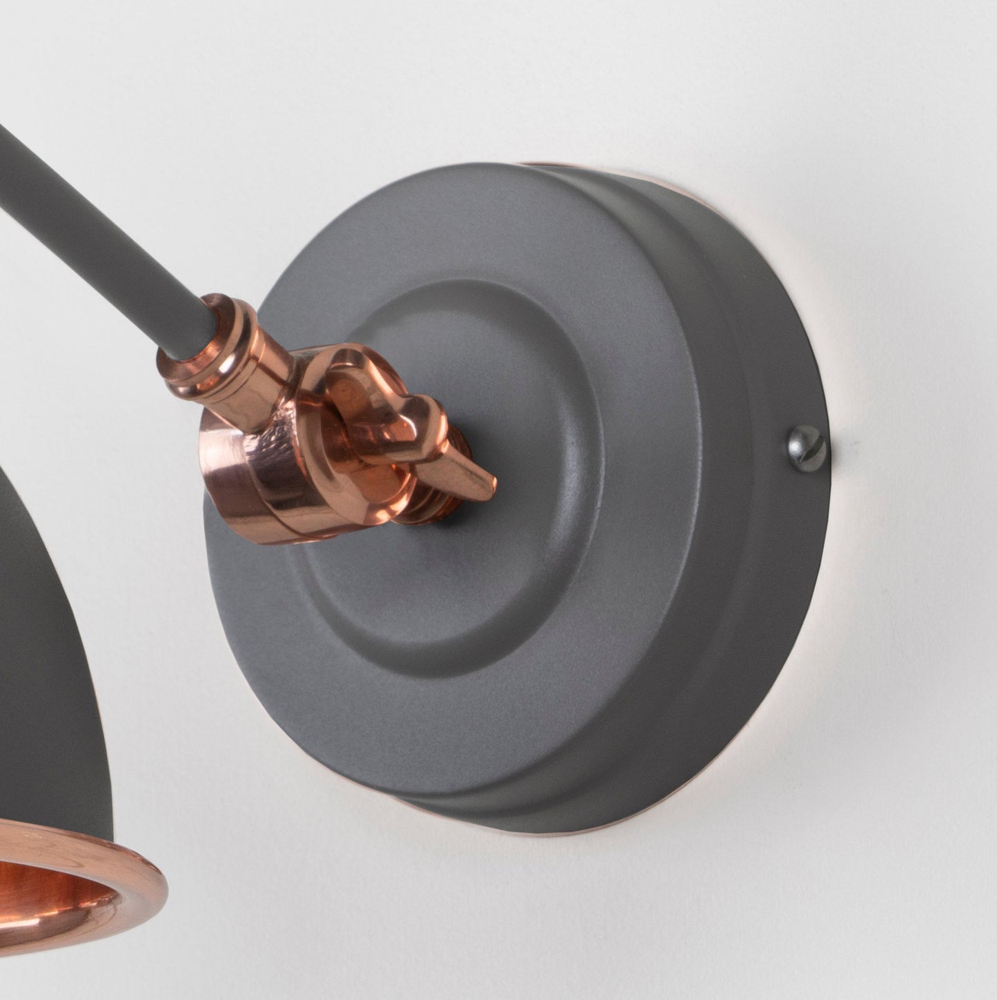 Hammered Copper Brindley Wall Light Bluff, close up view of fitting and cable.