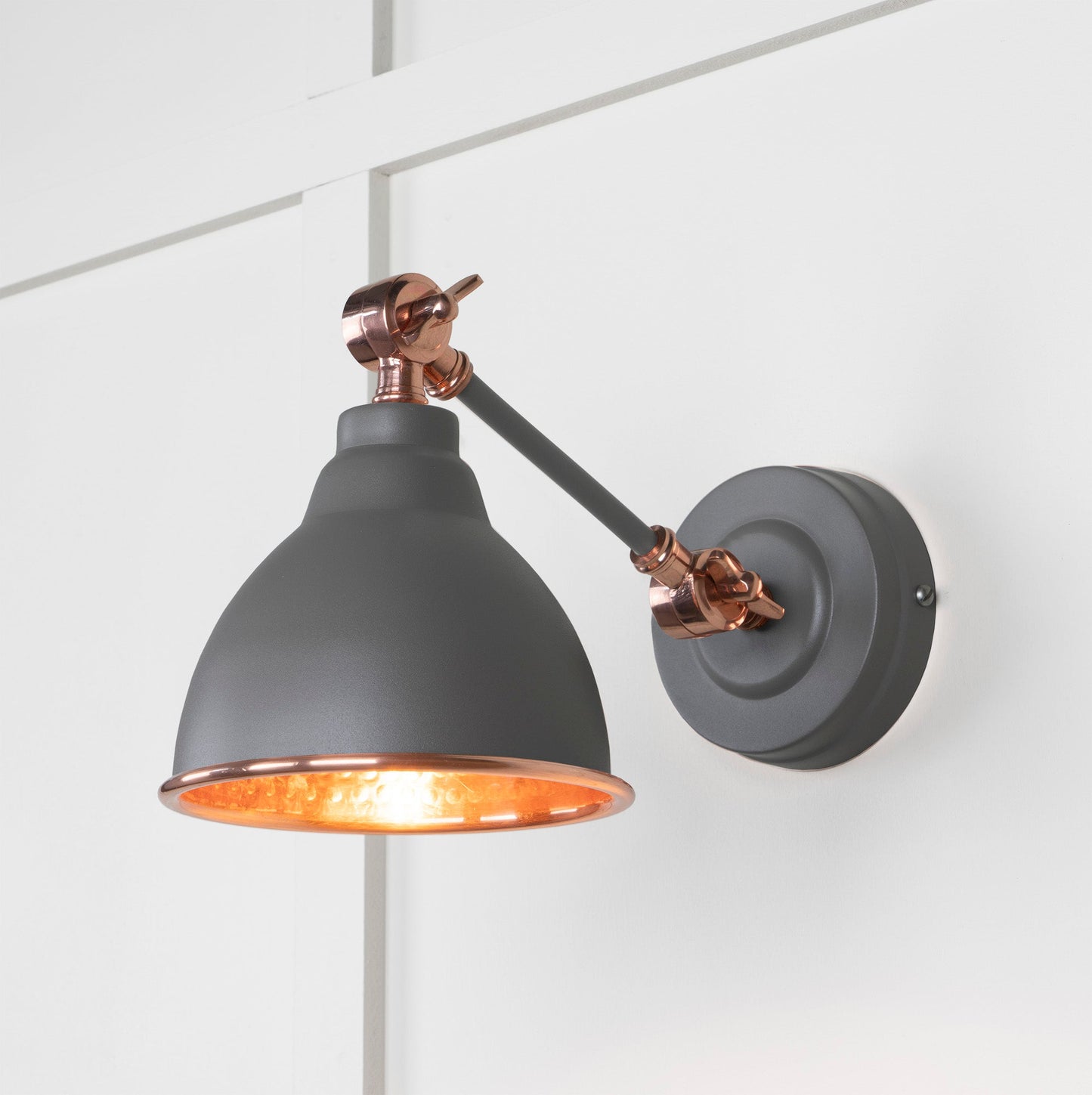 Hammered Copper Brindley Wall Light Bluff, Front Side with light on.