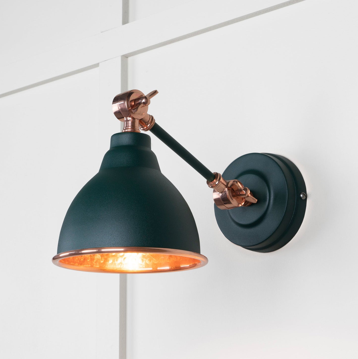 Hammered Copper Brindley Wall Light Dingle, Front Side with light on.