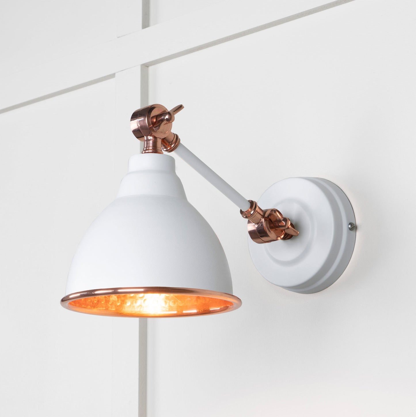 Hammered Copper Brindley Wall Light Flock, Front Side with light on.