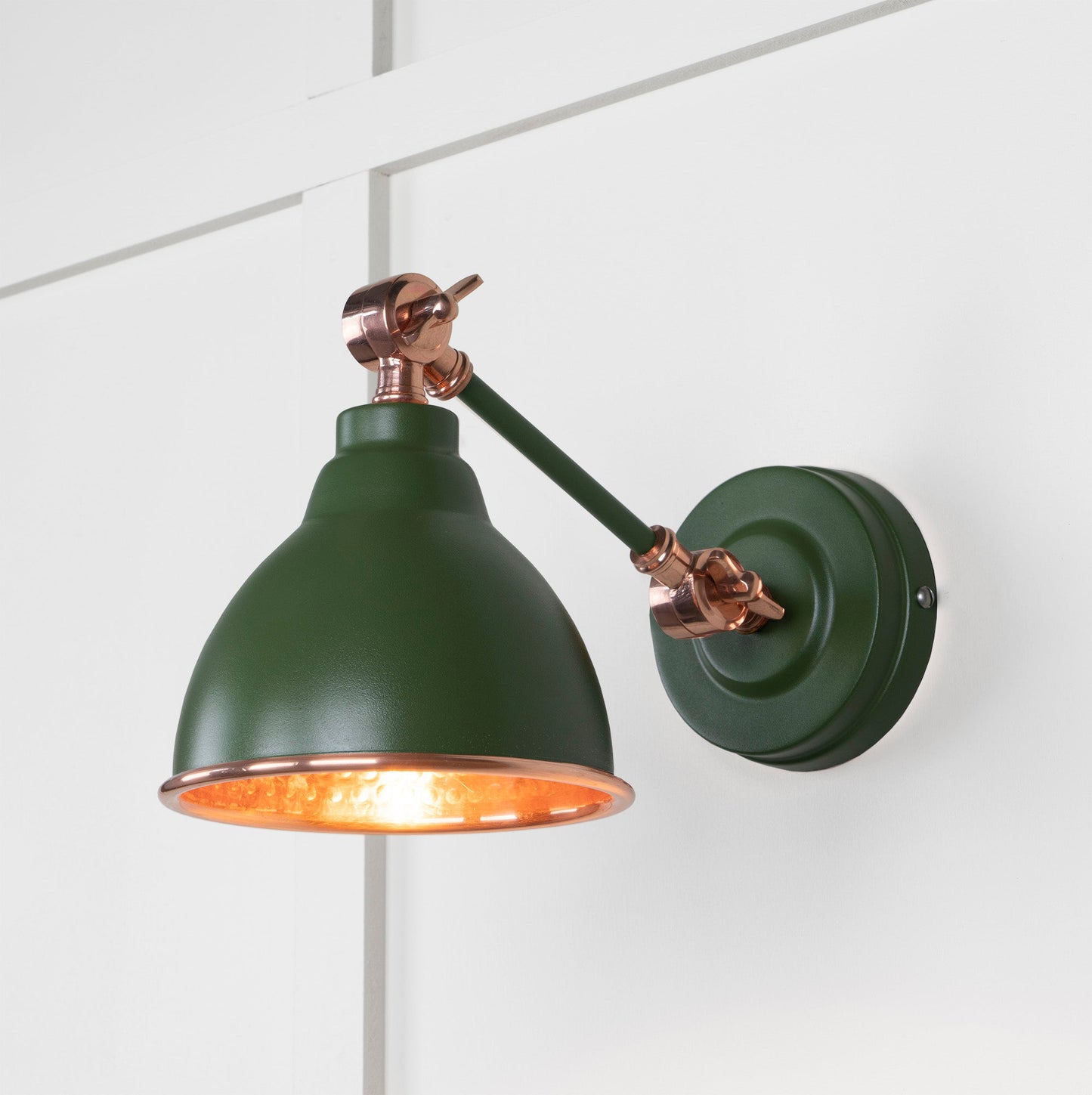 Hammered Copper Brindley Wall Light Heath, Front Side with light on.