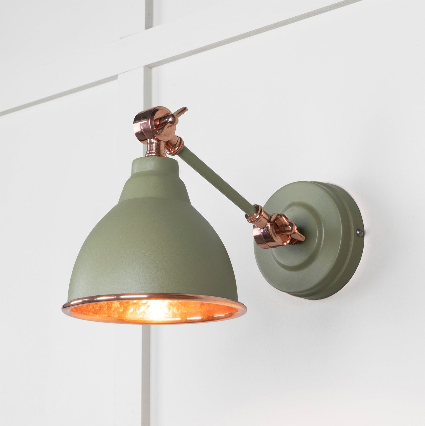 Hammered Copper Brindley Wall Light Tump, Front Side with light on.