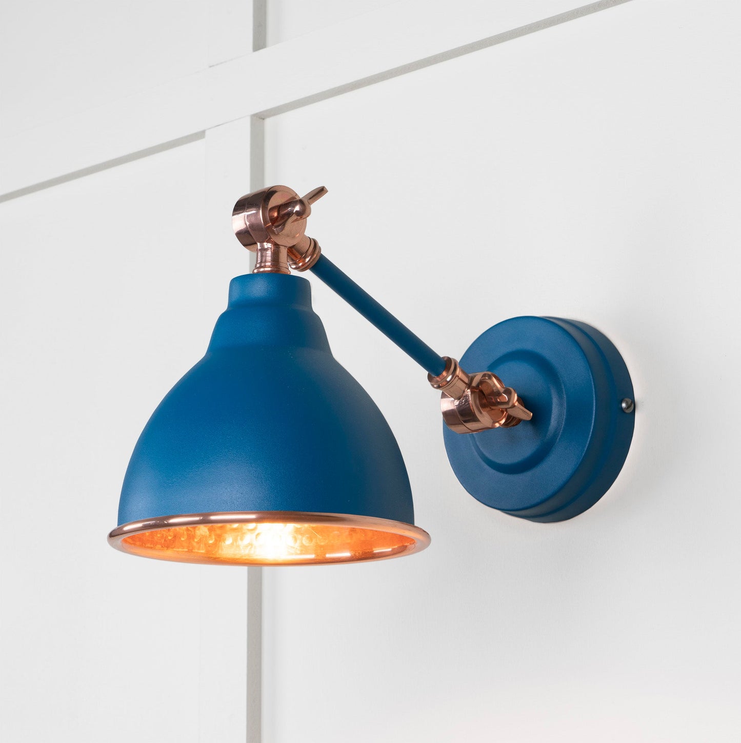 Hammered Copper Brindley Wall Light Upstream, Front Side with light on.