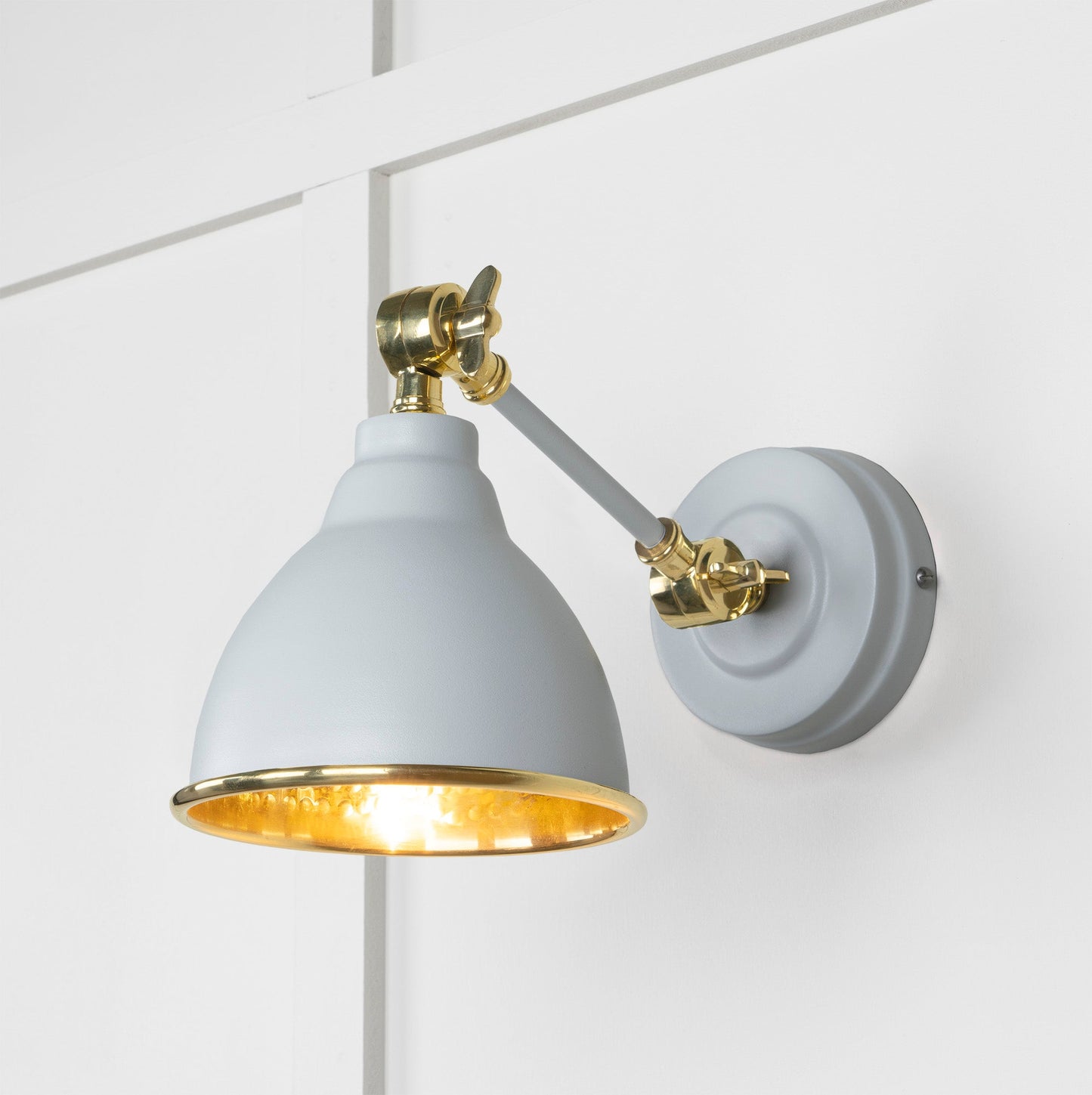 Hammered Brass Brindley Wall Light Birch, Front Side with light on.