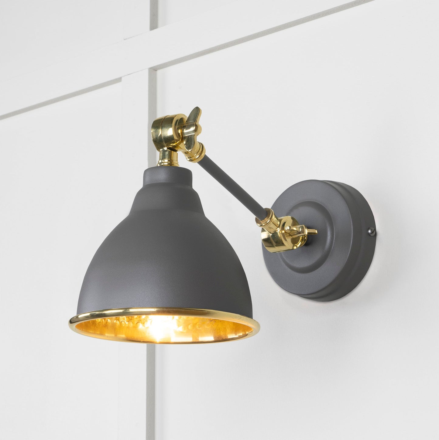 Hammered Brass Brindley Wall Light Bluff, Front Side with light on.