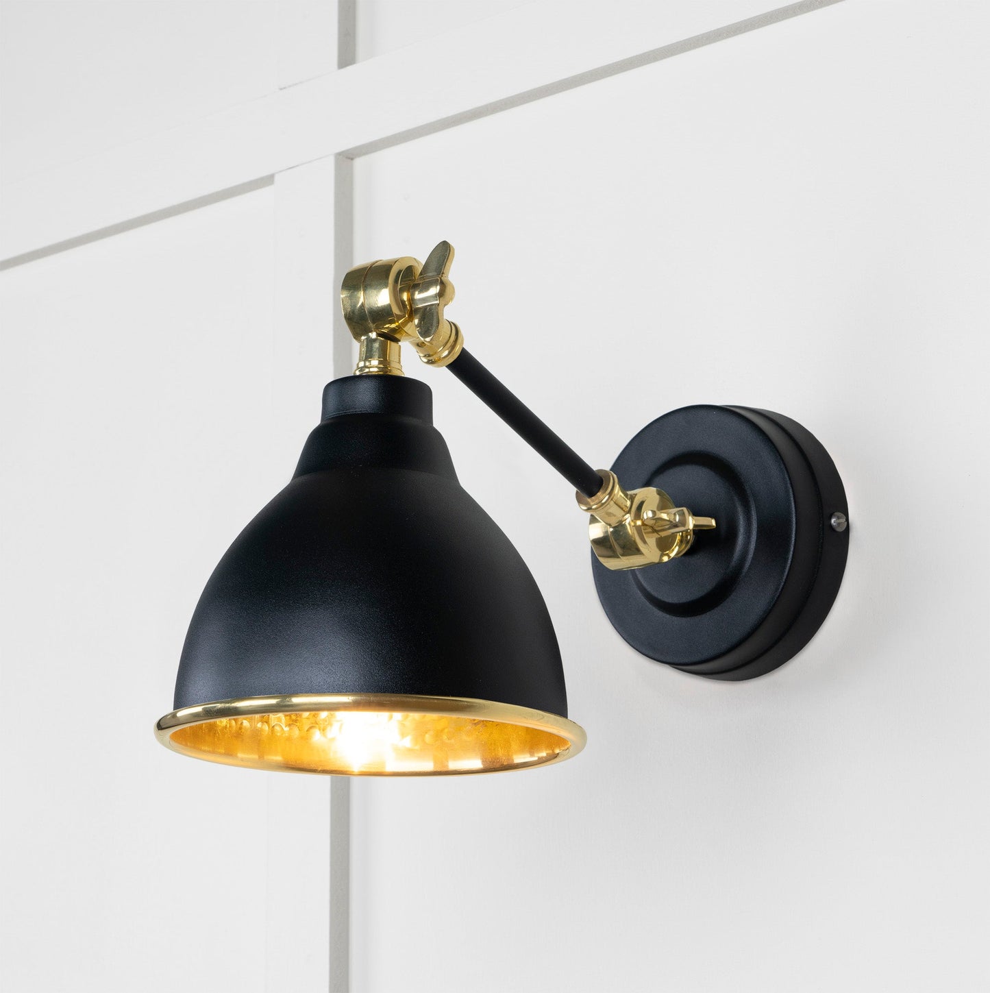 Hammered Brass Brindley Wall Light Elan Black, Front Side with light on.