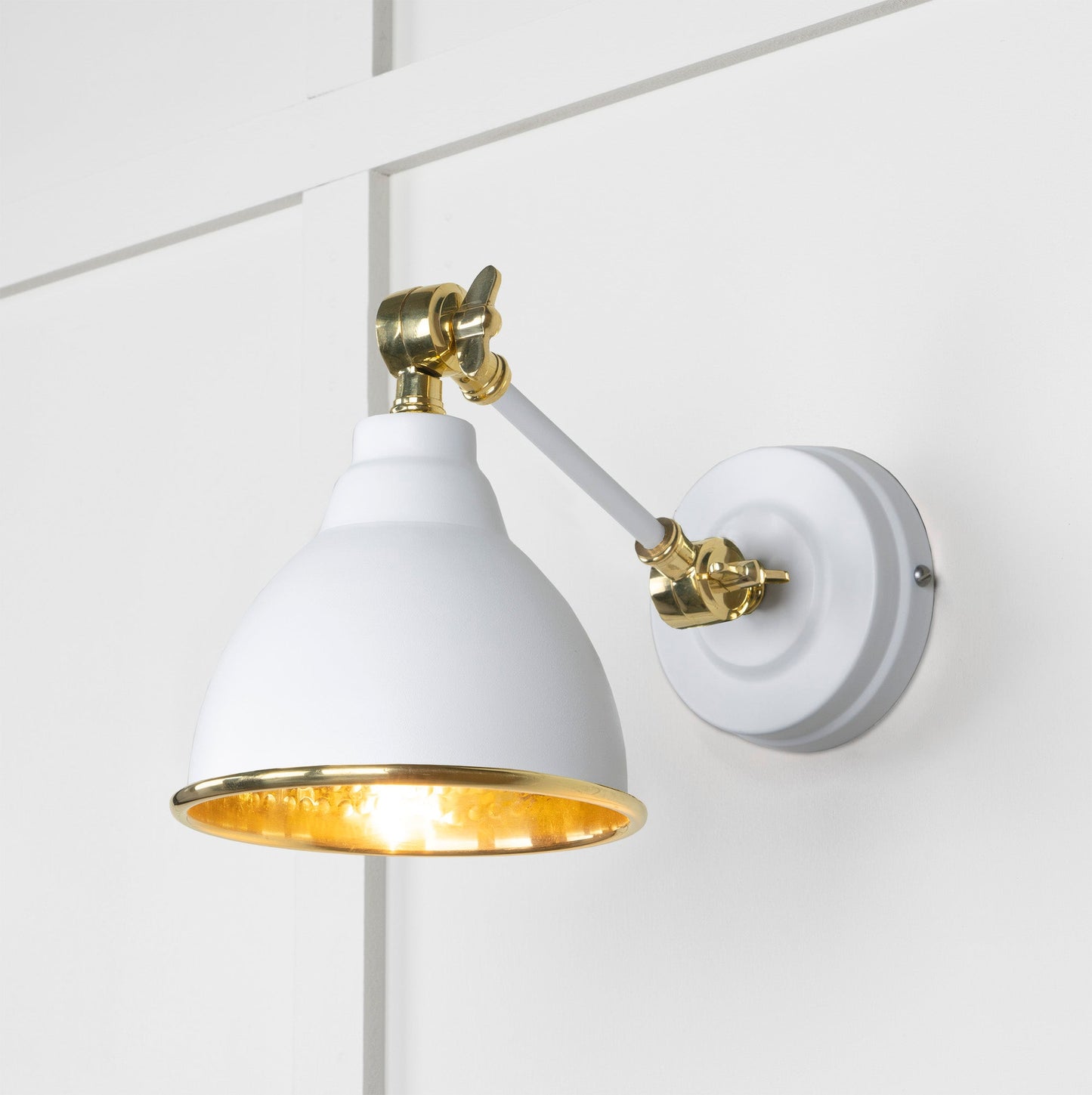 Hammered Brass Brindley Wall Light Flock, Front Side with light on.