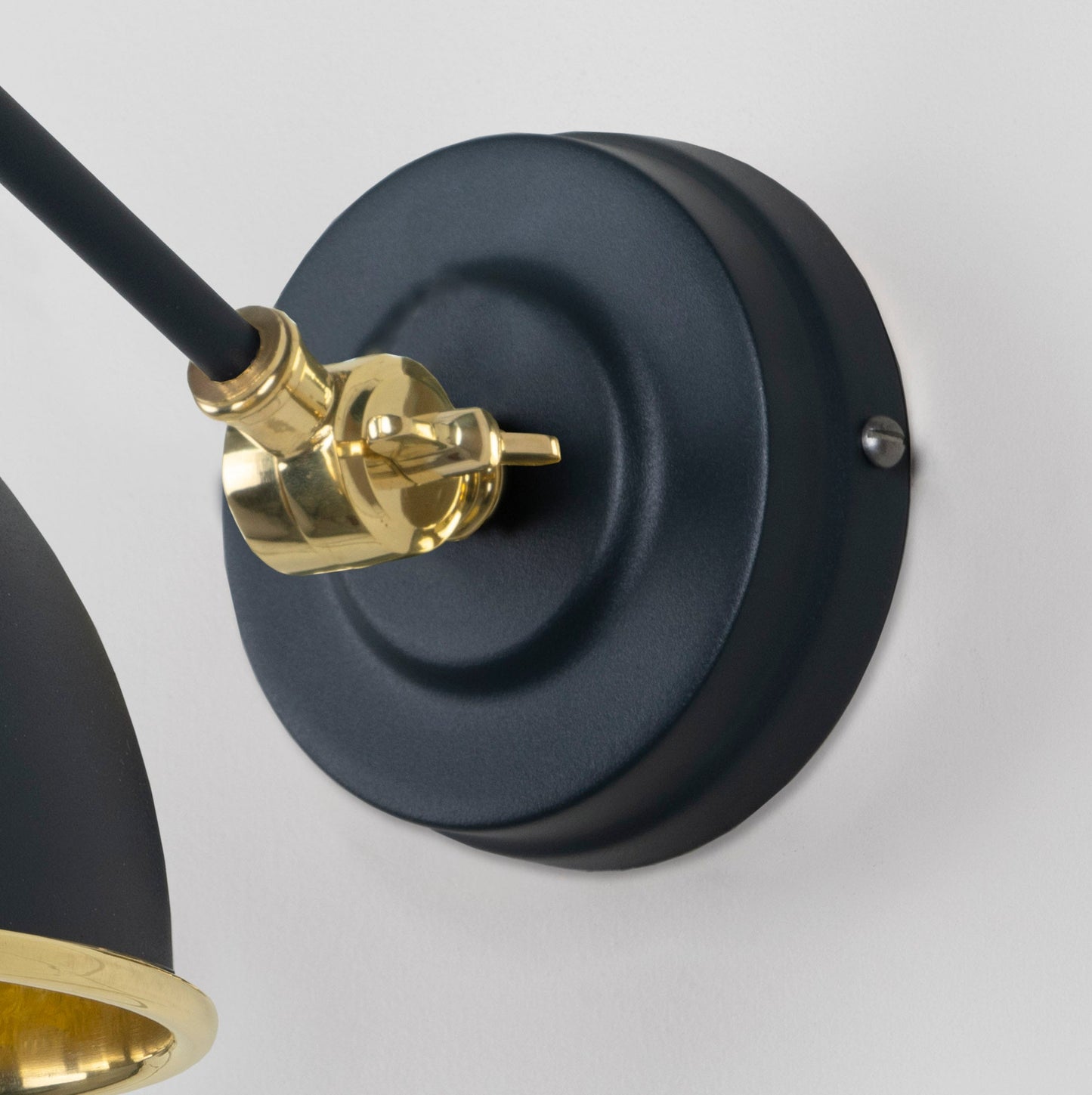 Hammered Brass Brindley Wall Light Soot, close up view of fitting and cable.