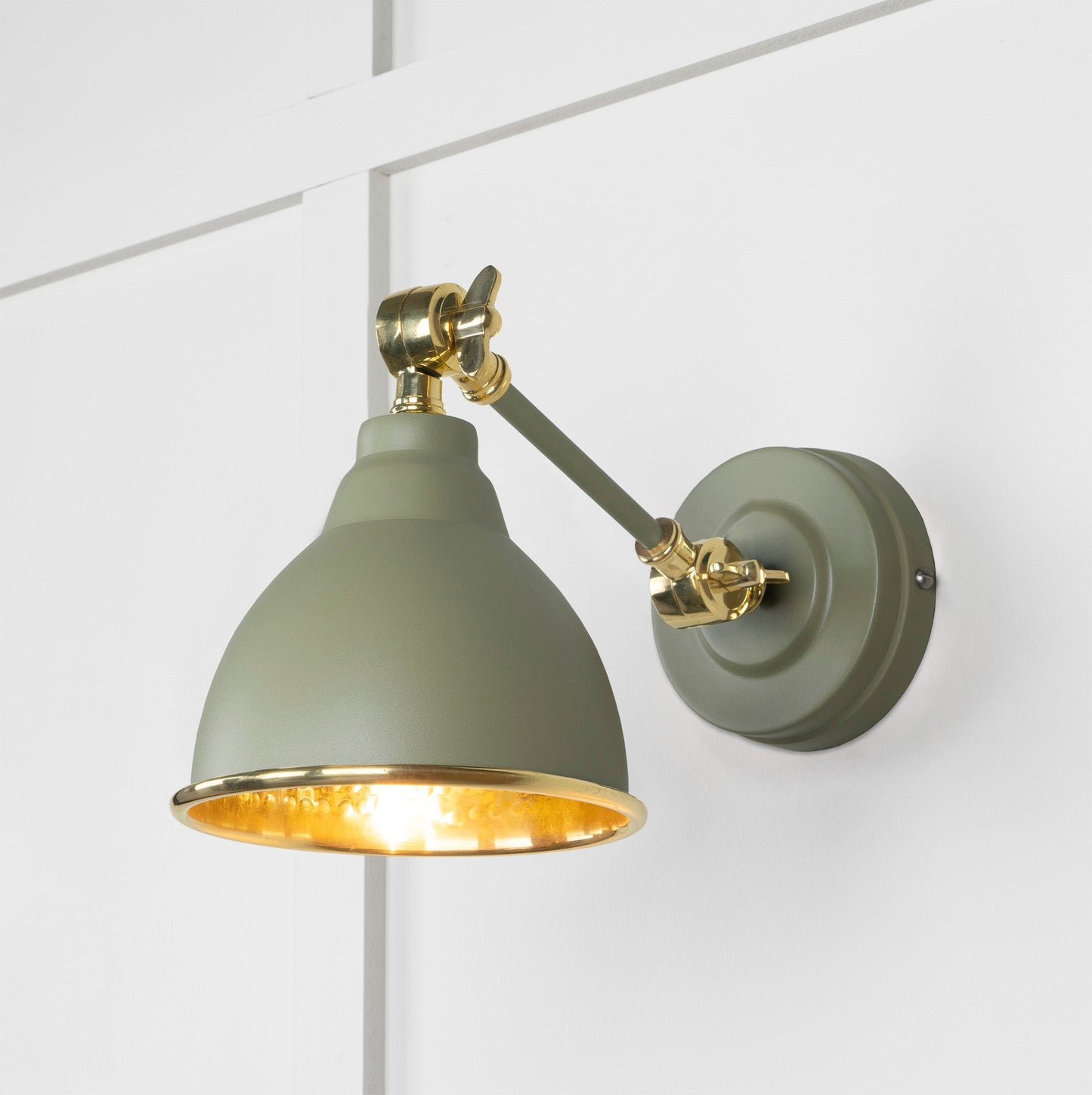 Hammered Brass Brindley Wall Light Tump, Front Side with light on.