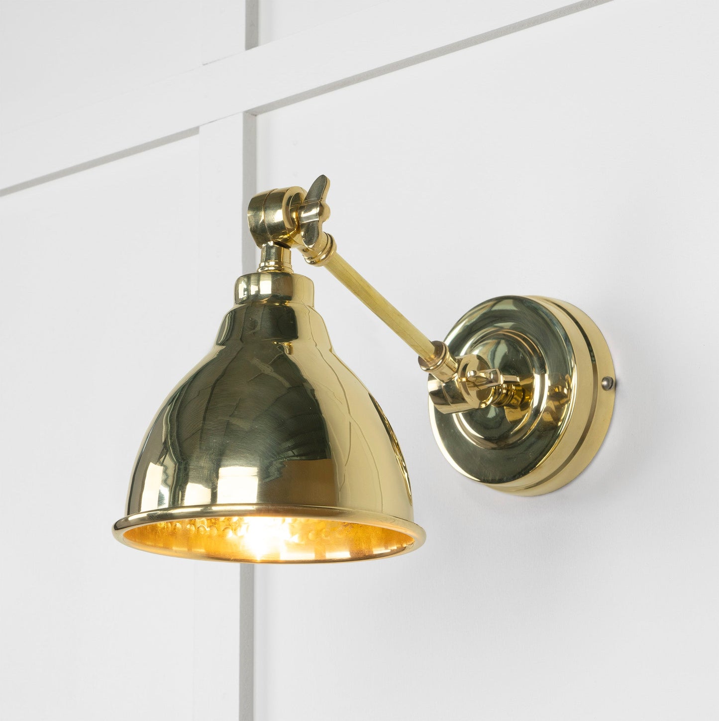 Hammered Brass Brindley Wall Light , Front Side with light on.