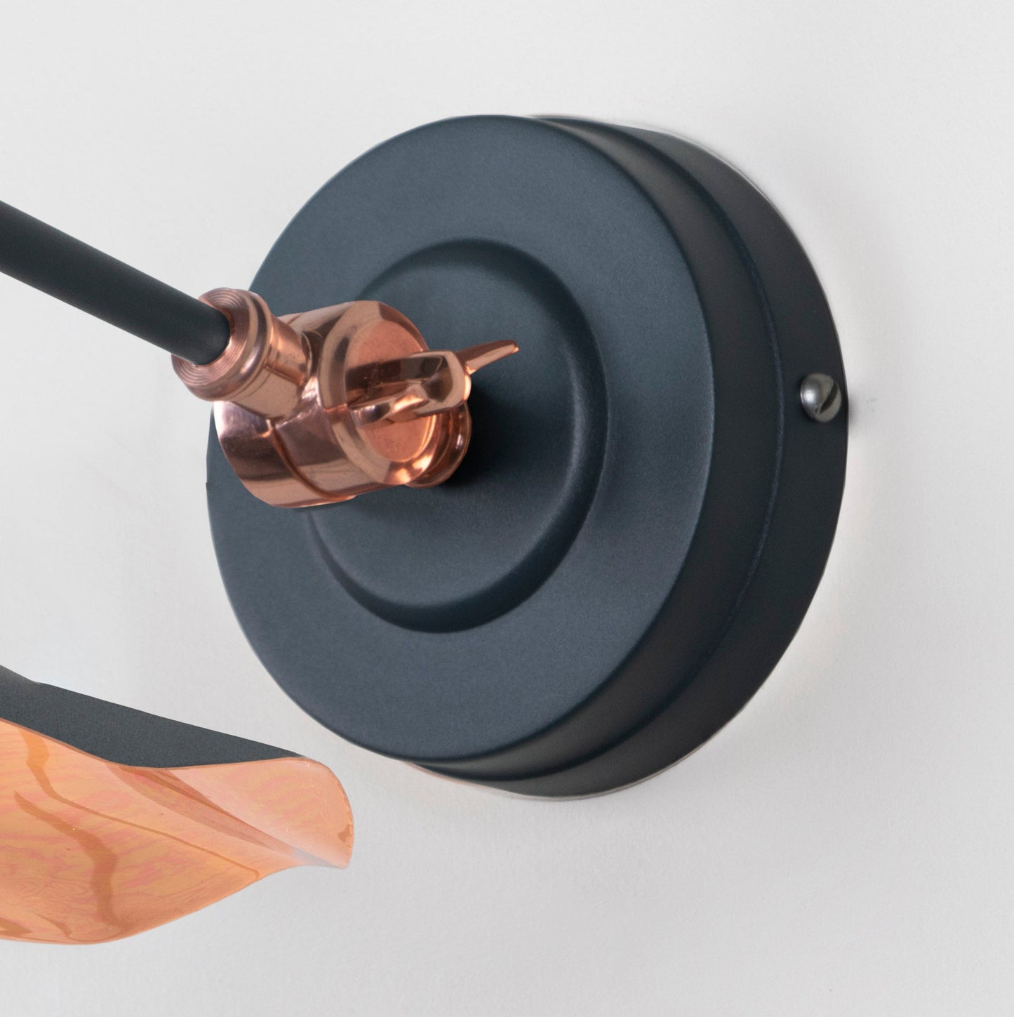 Smooth Copper Flora Wall Light Soot, close up view of fitting and cable.