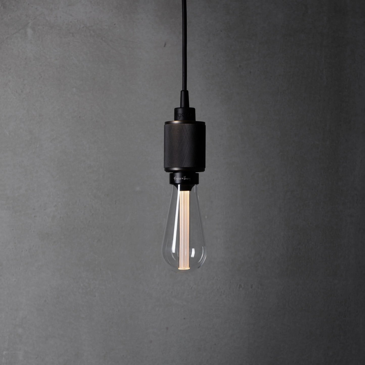 Heavy Metal Pendant light / Cross smoked bronze, front view.