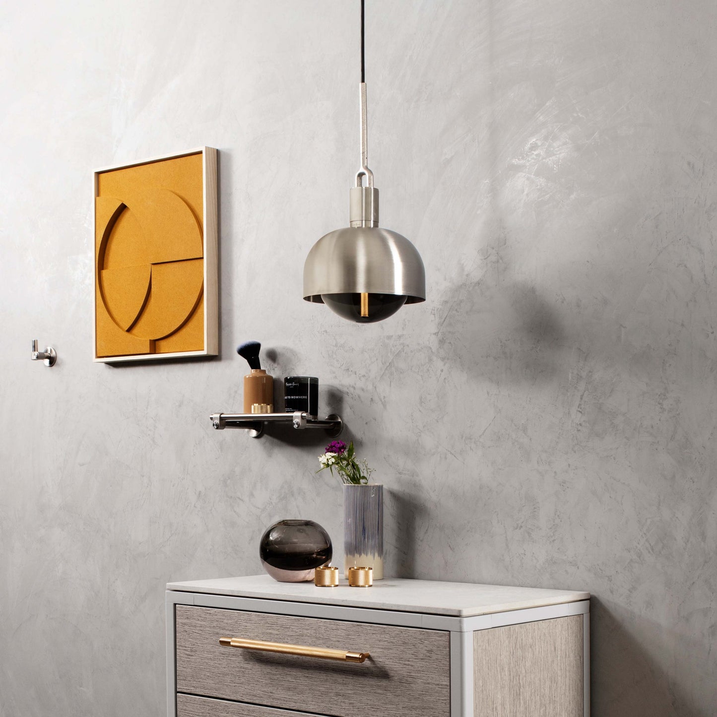 Forked Pendant Light / Shade / Globe / Smoked / Medium Steel, hanging from ceiling in setting with background.