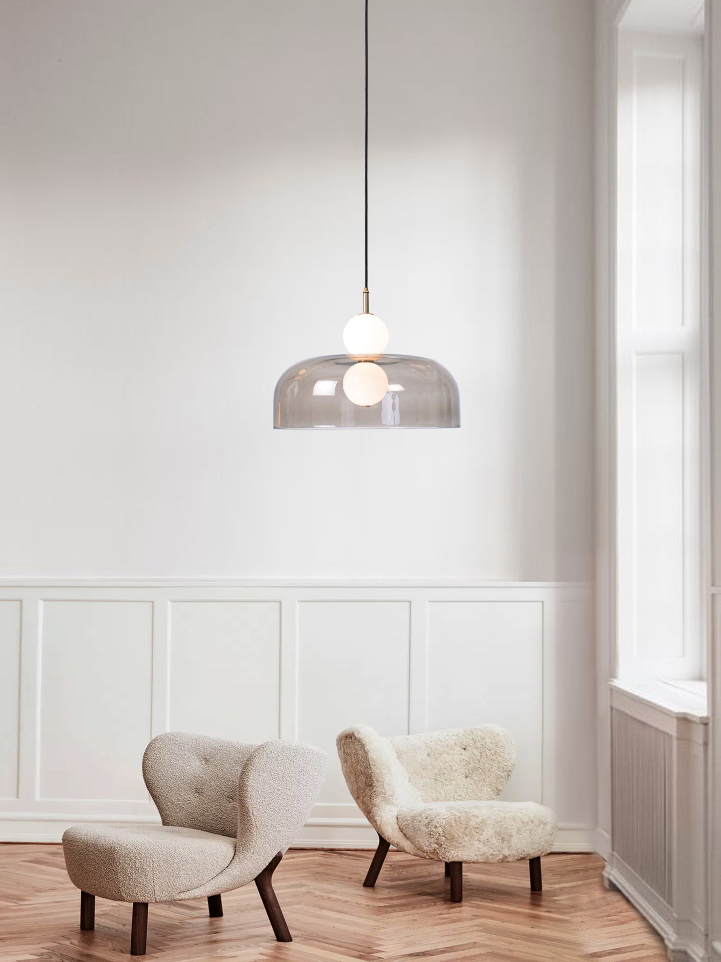 Echo Shade Pendant Light, hanging from ceiling above chairs in setting.