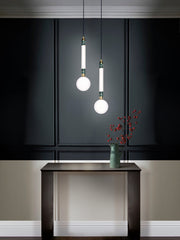 Greenstone Small Pendant Light, hanging from ceiling above table in setting.