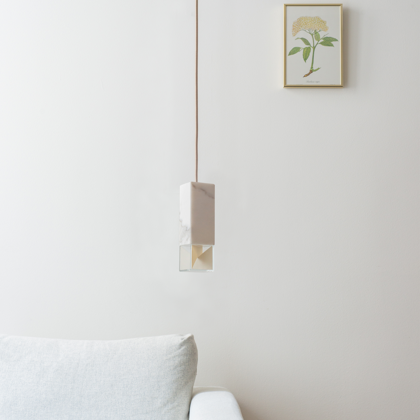 Lamp One Pendant Light / Marble, in living room setting.