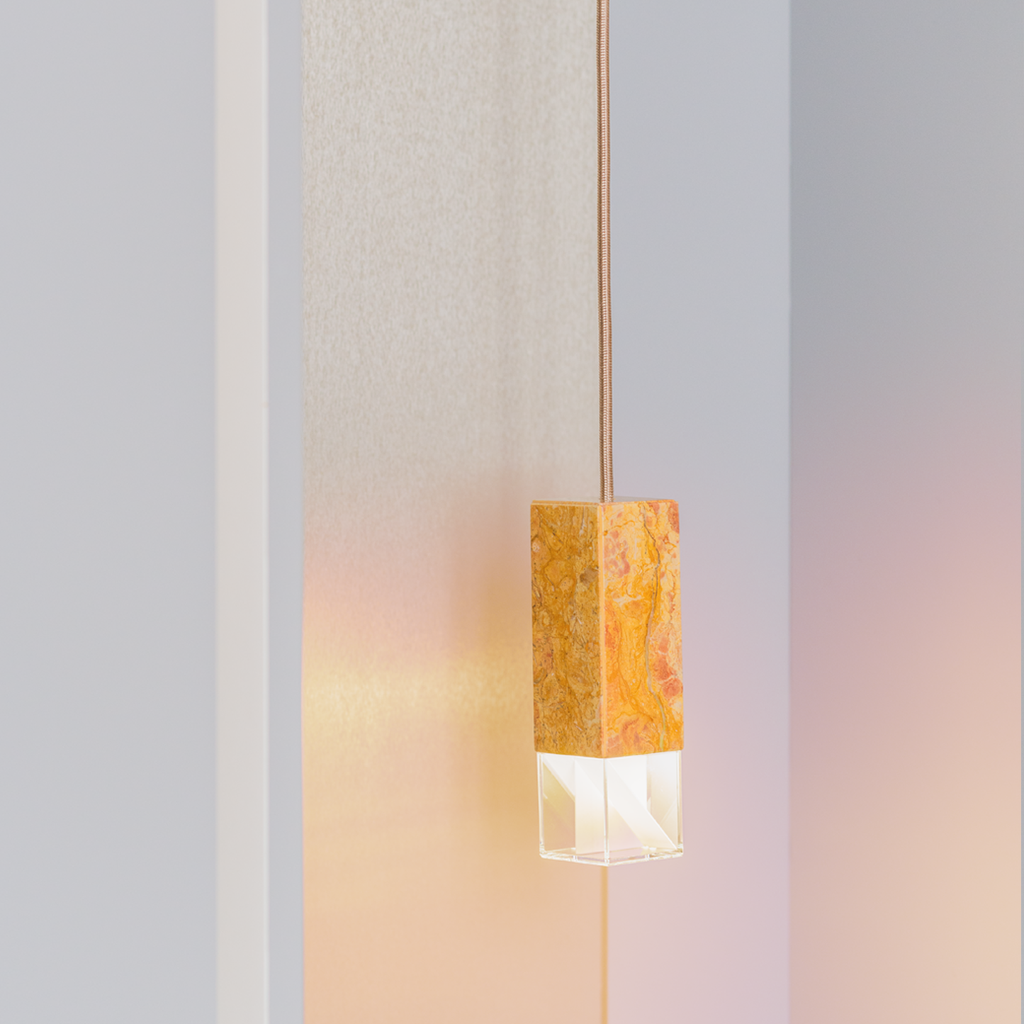 Lamp One Pendant Light / Yellow, view of light on in setting.