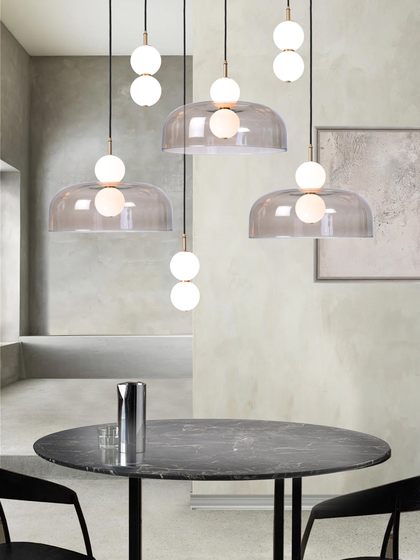 Echo Wide Shade Cluster Light, hanging from ceiling above dining table in setting.