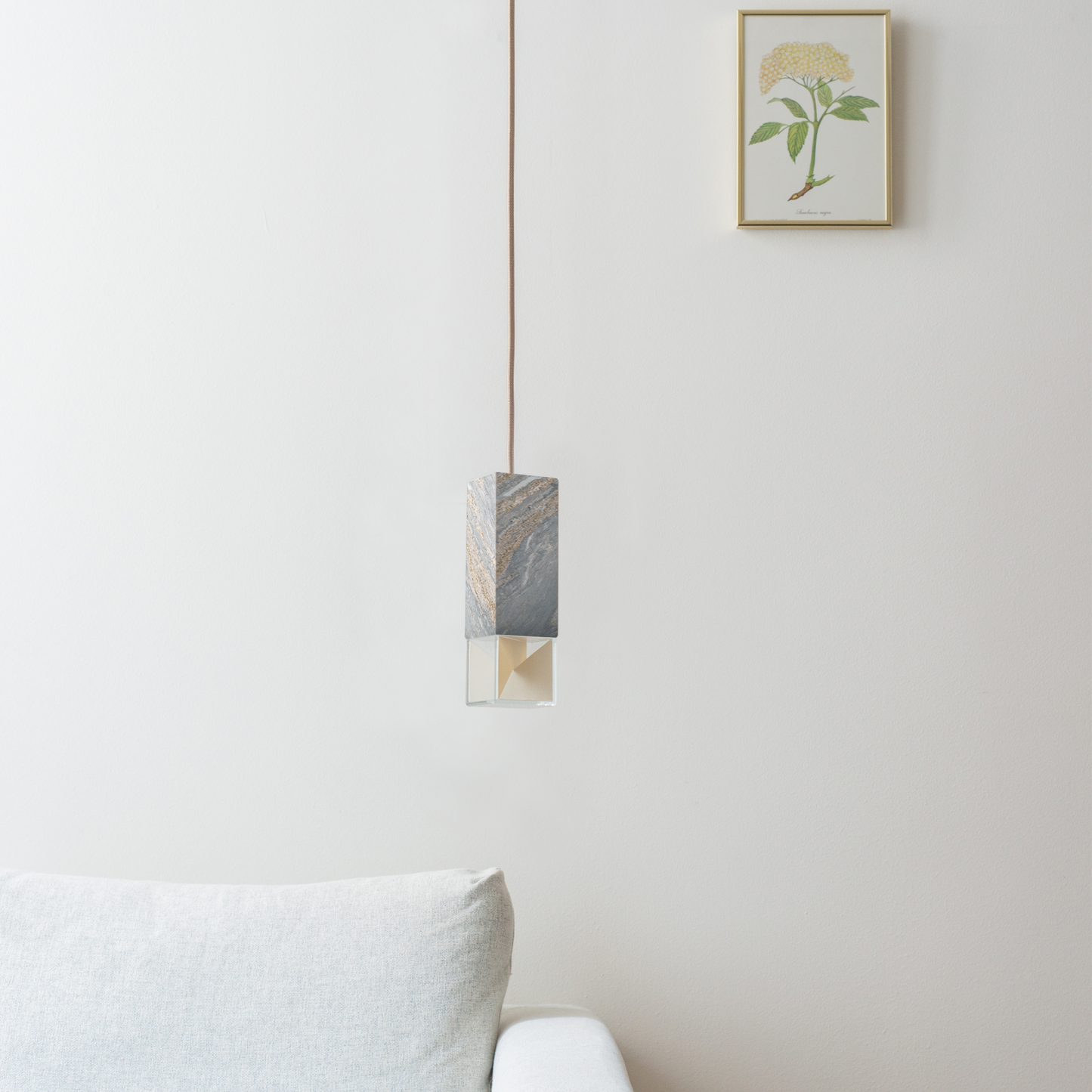 Lamp One Pendant Light / Marble, hanging from ceiling in living room setting.