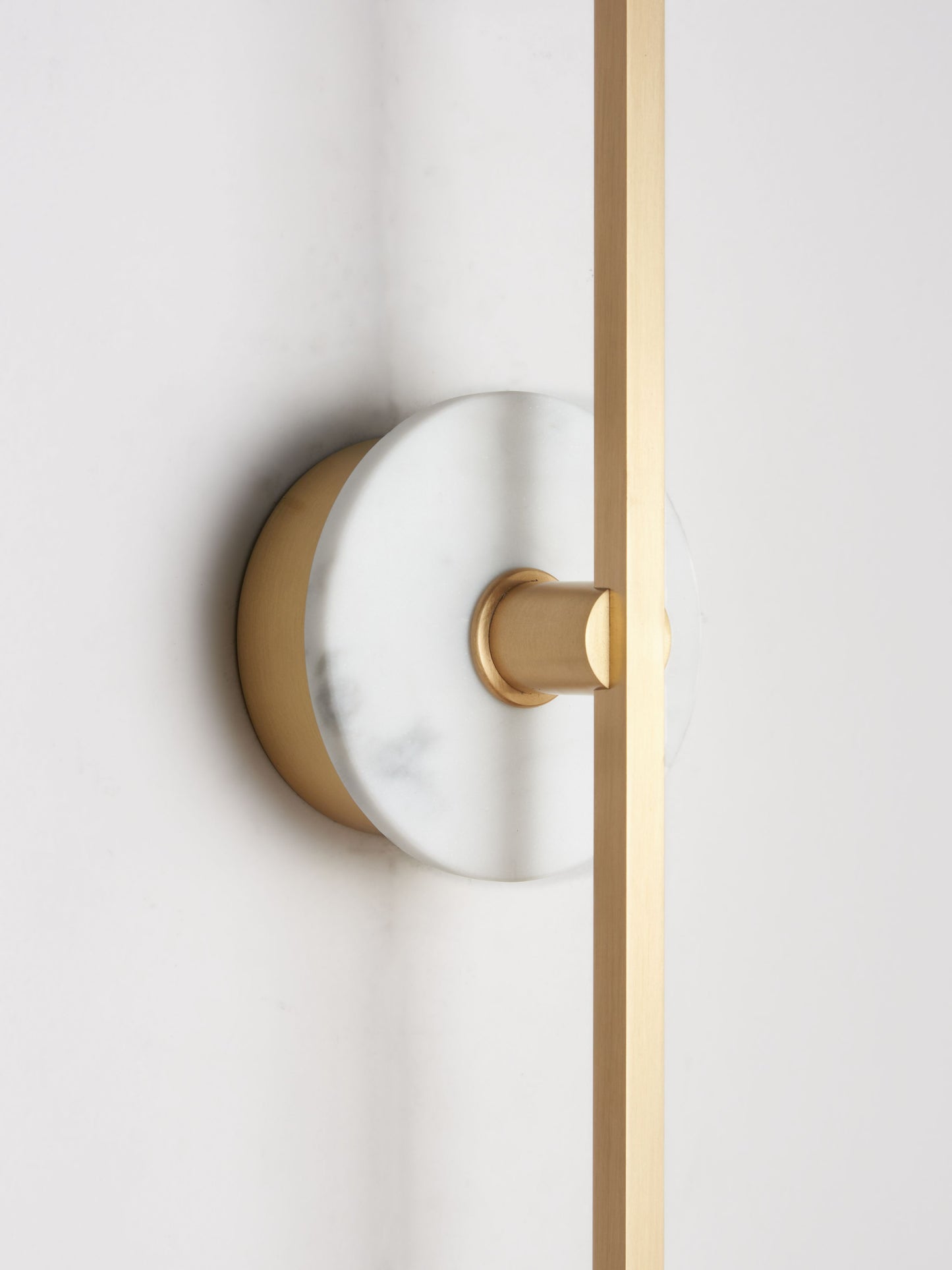 Stick Wall Light brass & white marble, close up of fitting