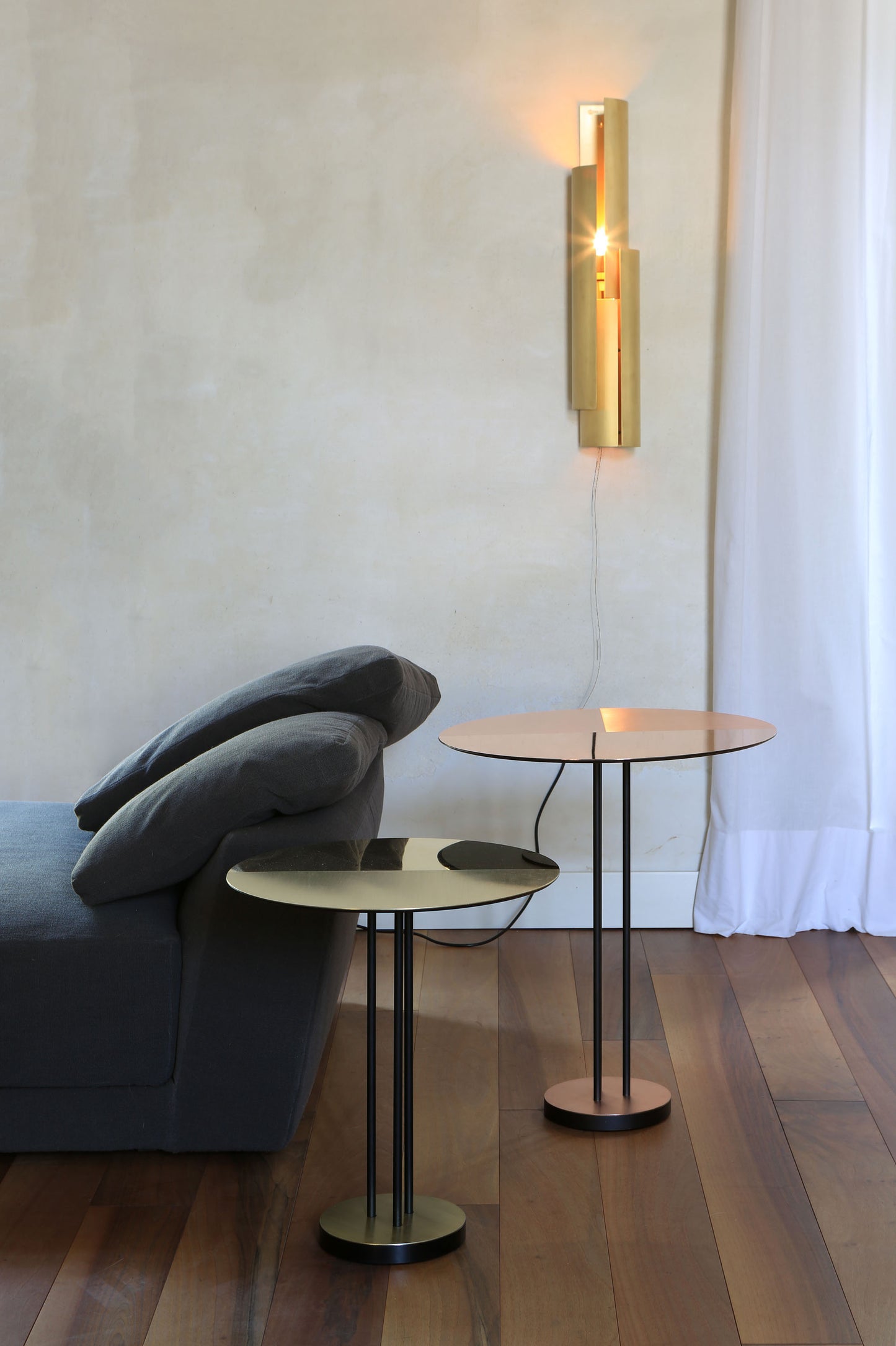 Piega Wall Light, in living room setting on wall.