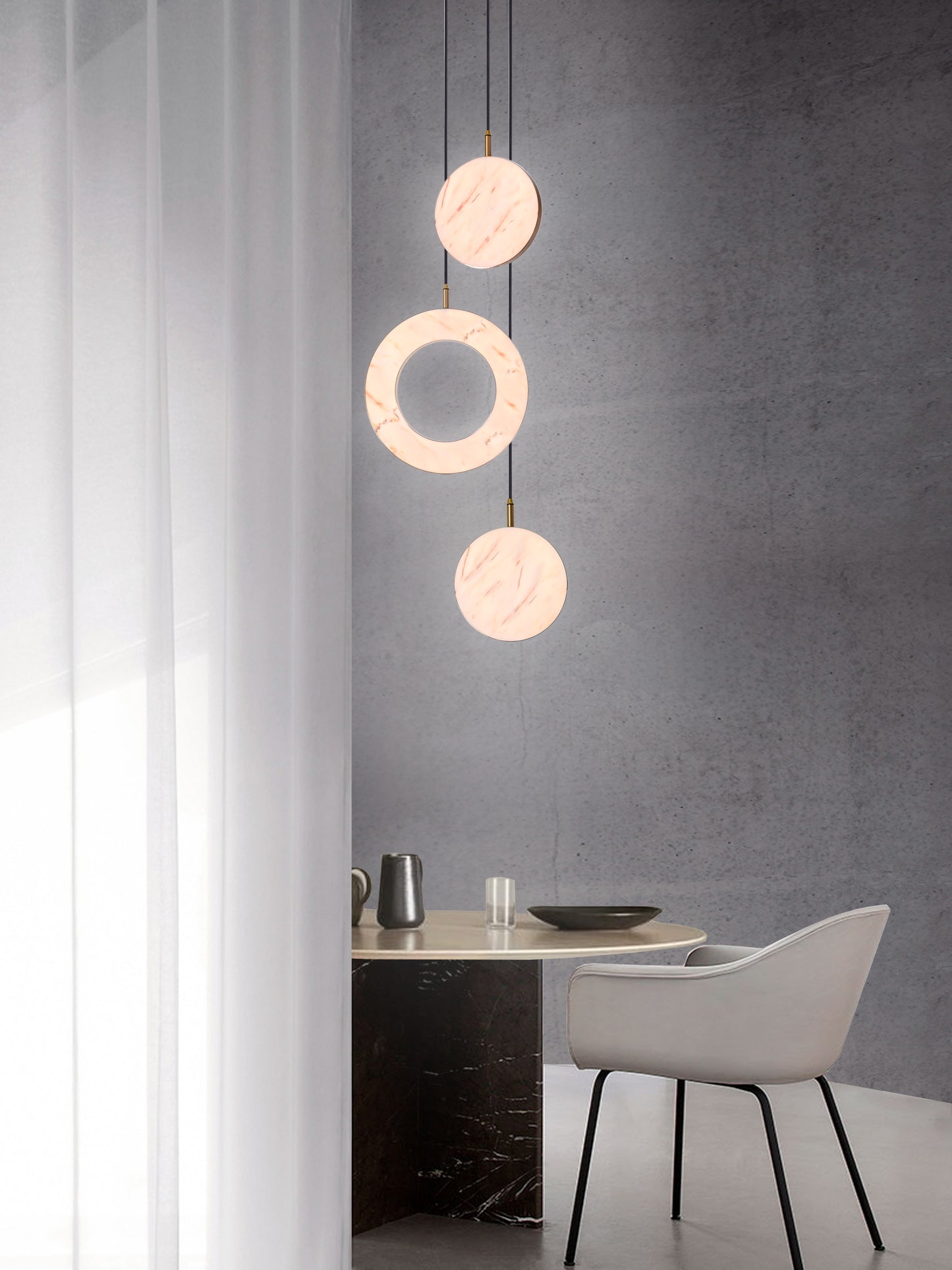 Rosa Ring 3 Cluster Light, hanging from ceiling above table in setting.