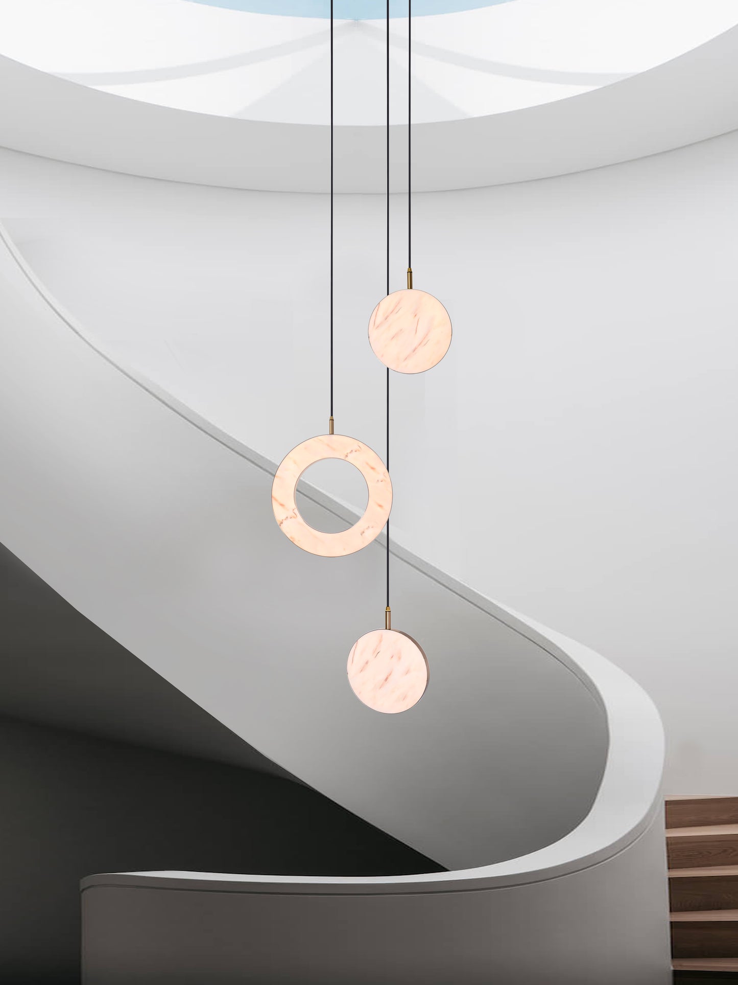 Rosa Ring 3 Cluster Light, hanging from ceiling above stairs in setting.