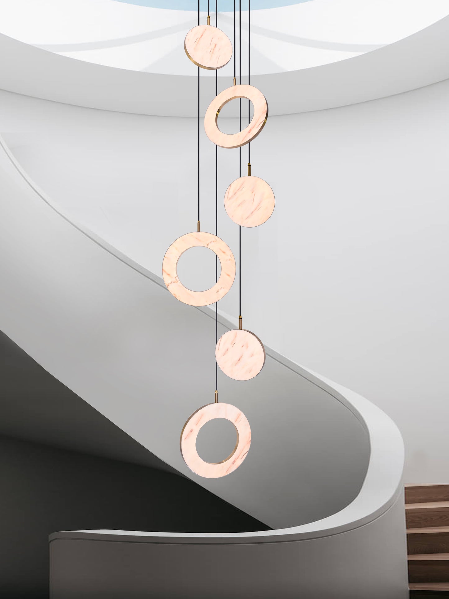 Rosa Ring 6 Cluster Light, hanging from ceiling in stairs in setting.