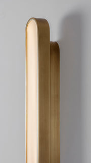 Capsule Wall Light brushed brass, detailed close of view of finish.