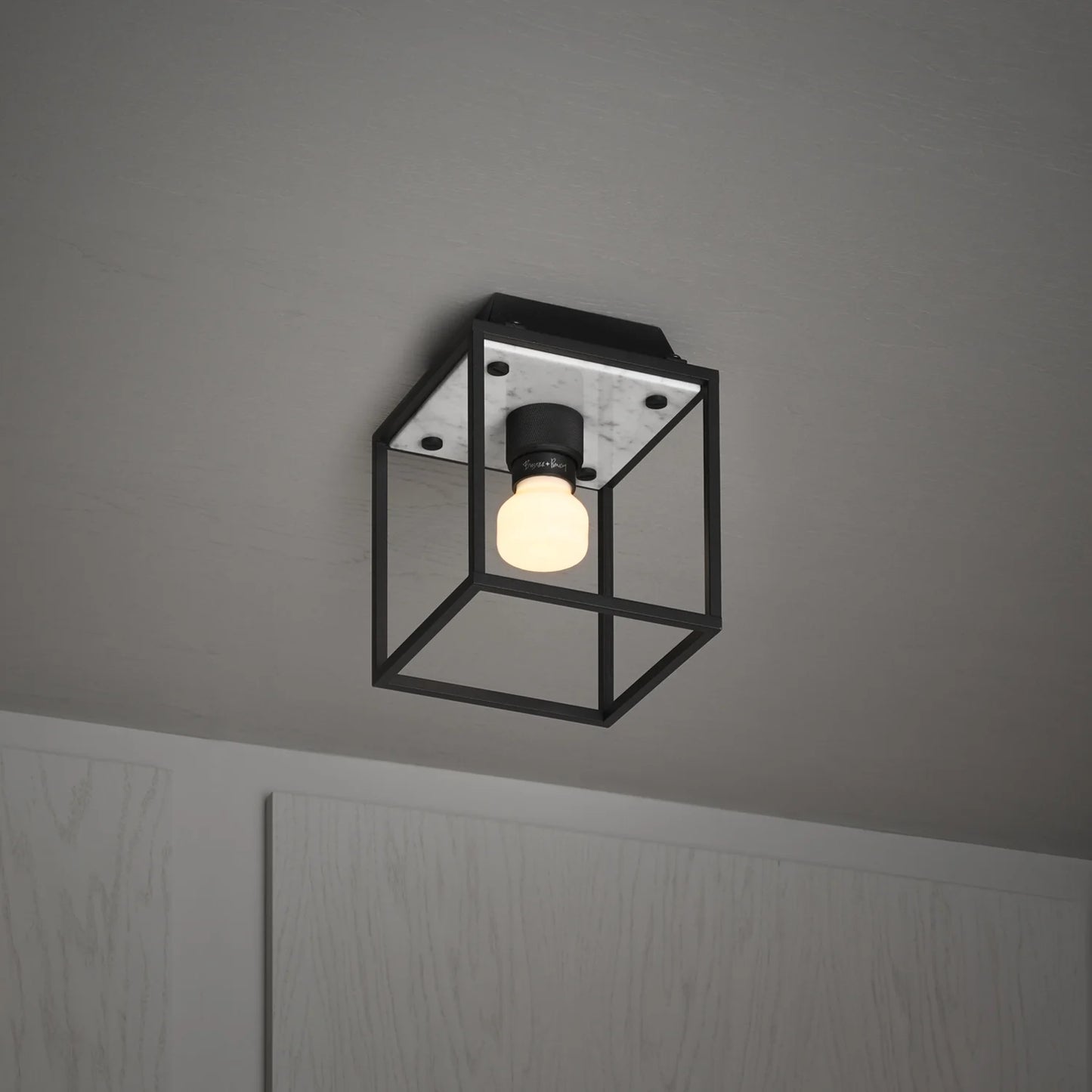 Caged Ceiling Light / Small in white marble, on side view.