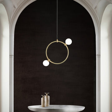 Drops Pendant Light, hanging from ceiling above table in setting.