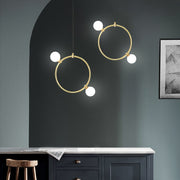 Drops Pendant Light duo, hanging from ceiling above kitchen island in setting.
