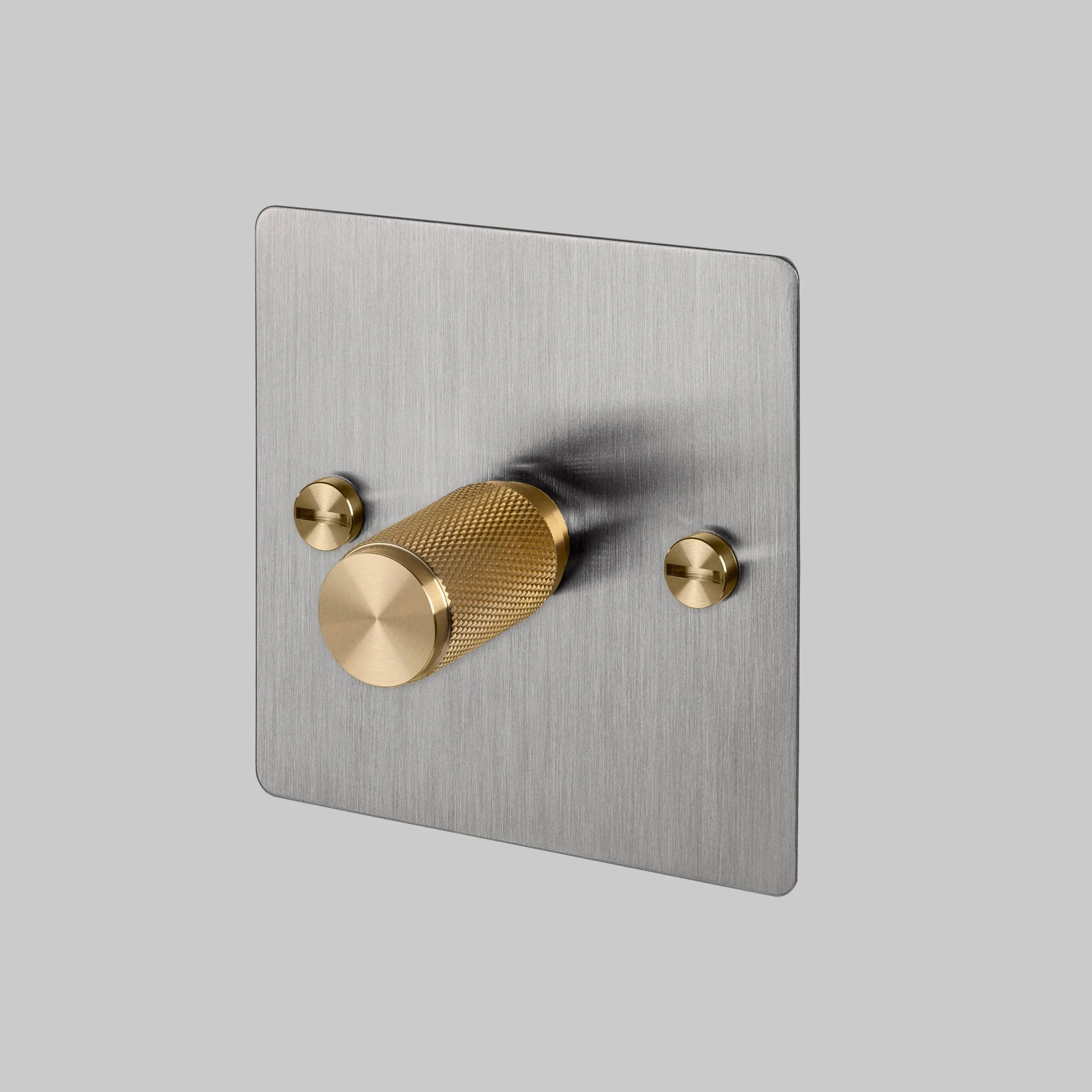 1G Dimmer/ 120W/ Steel with brass details, angled view.