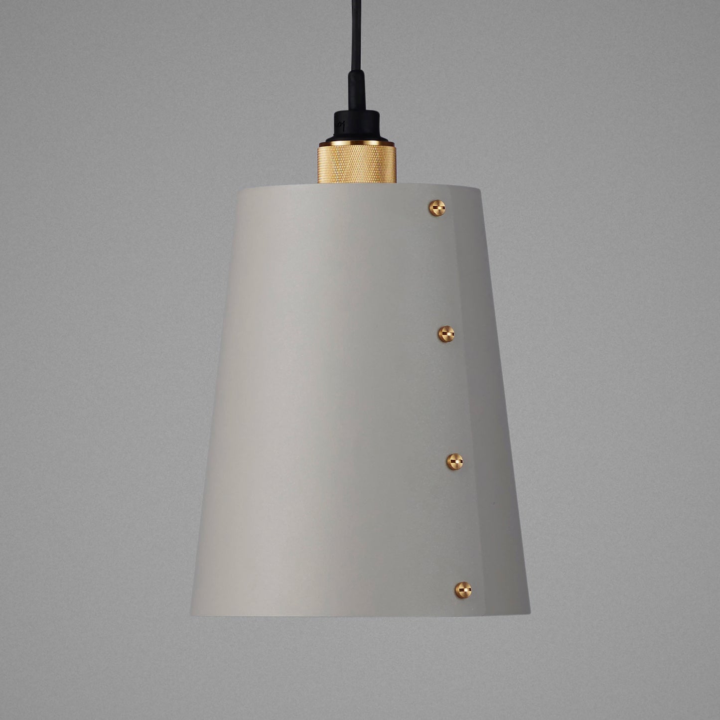 Hooked 1.0 Large Pendant Light / Stone brass, detailed close up of shade and knurling.