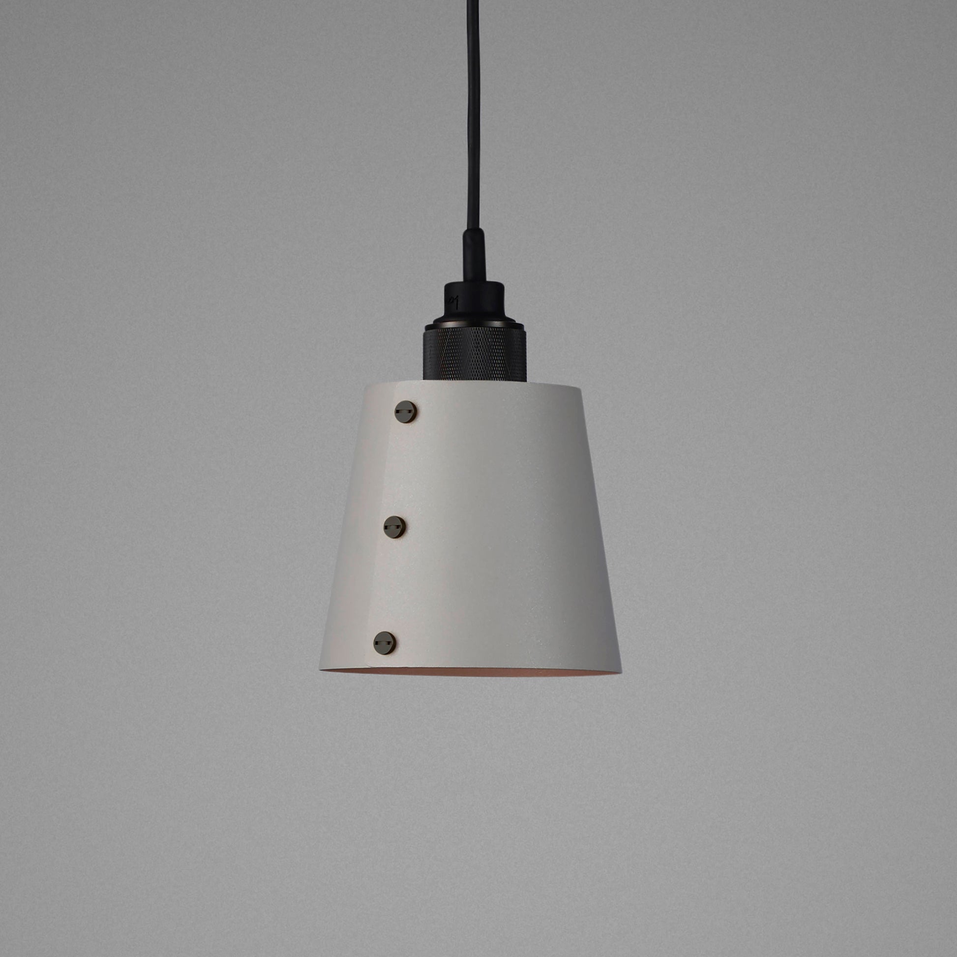 Hooked 1.0 Small Pendant Light / Stone smoked bronze, detailed close up of shade and knurling.