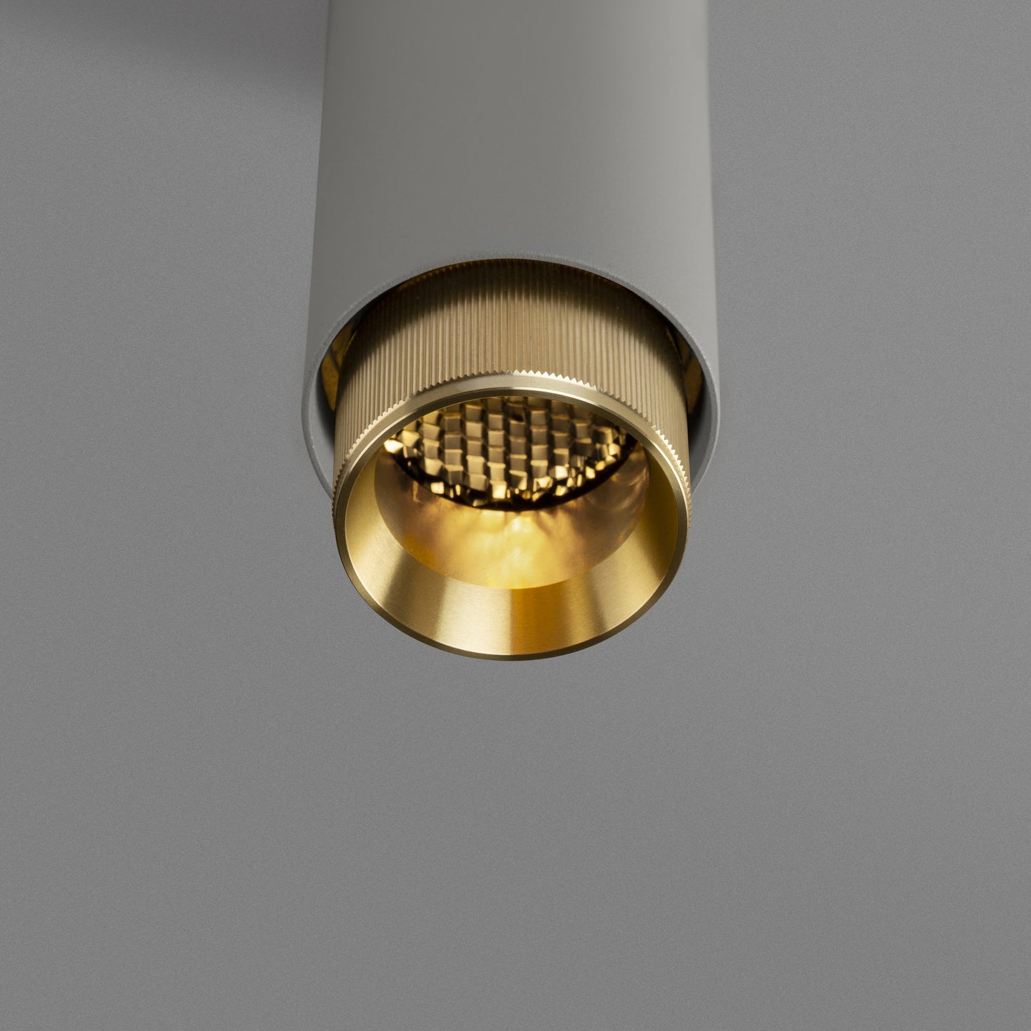Exhaust Pendant Light / Linear / Stone Brass, detailed close up view from upneath of knurling and light.