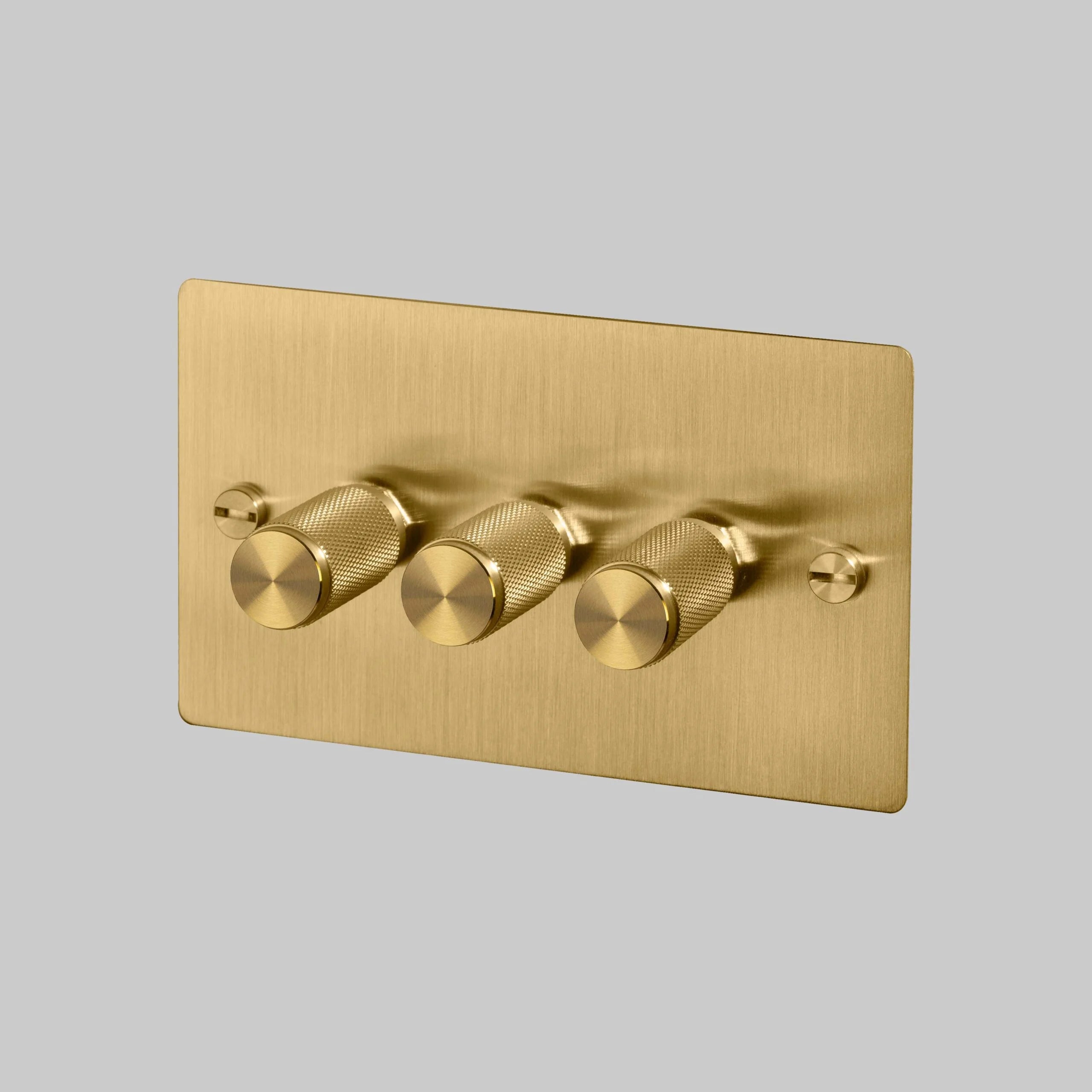 3G Dimmer/ 120W/ Brass with brass details, angled view.