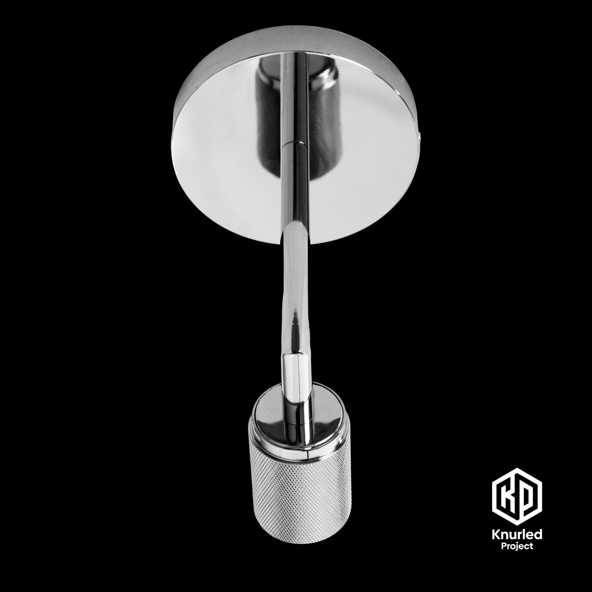 Chrome wall light birdseye view on a black background