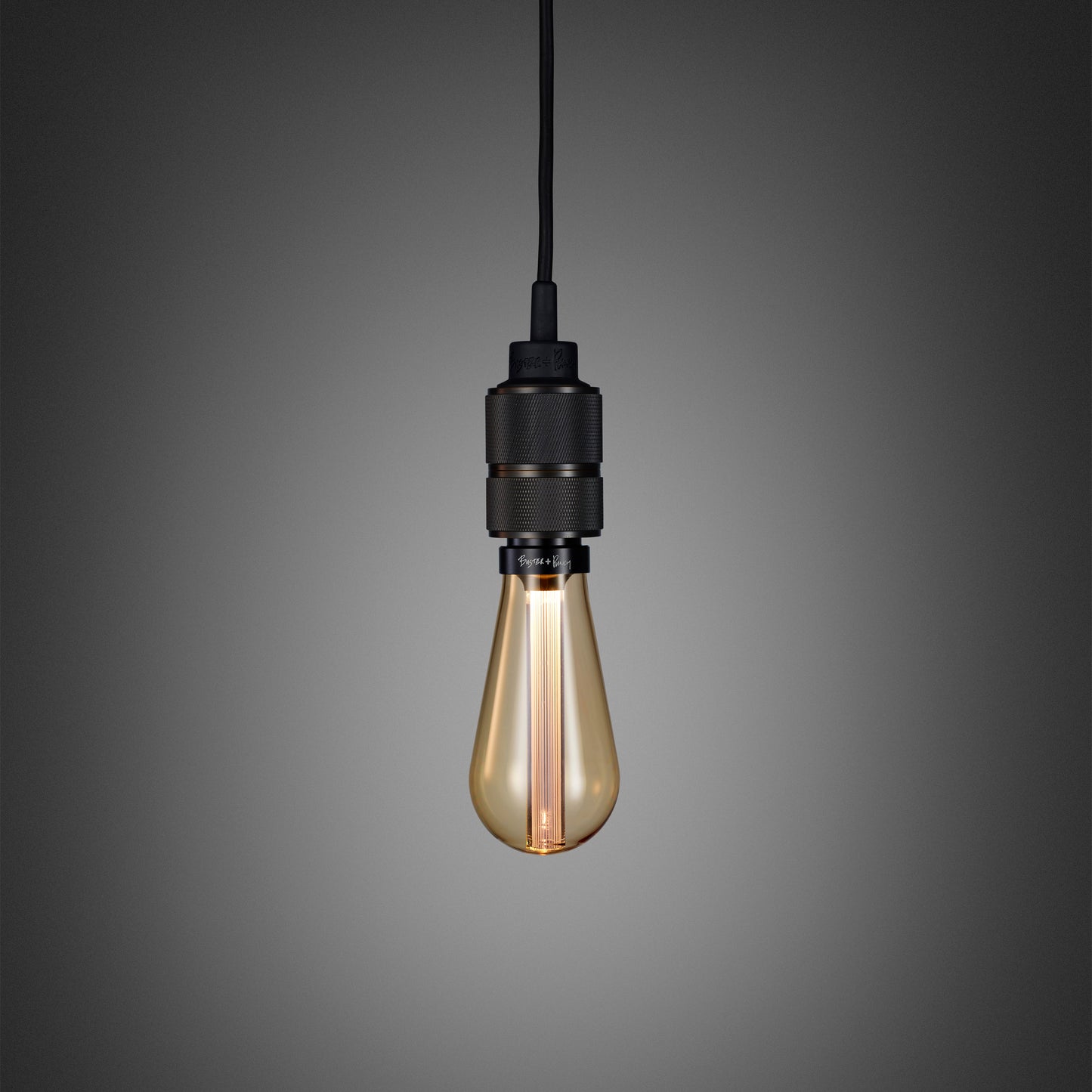 Hooked 1.0 Pendant Light / Nude Smoked bronze, close up view with gold bulb.