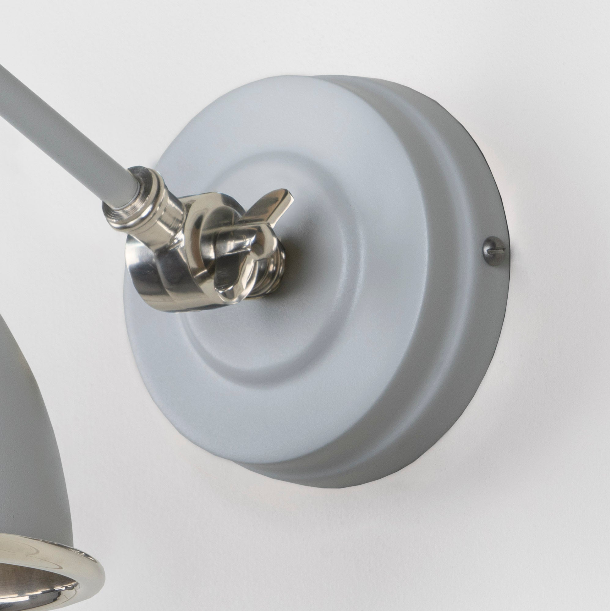 Smooth Nickel Brindley Wall Light Birch, close up view of fitting and cable.