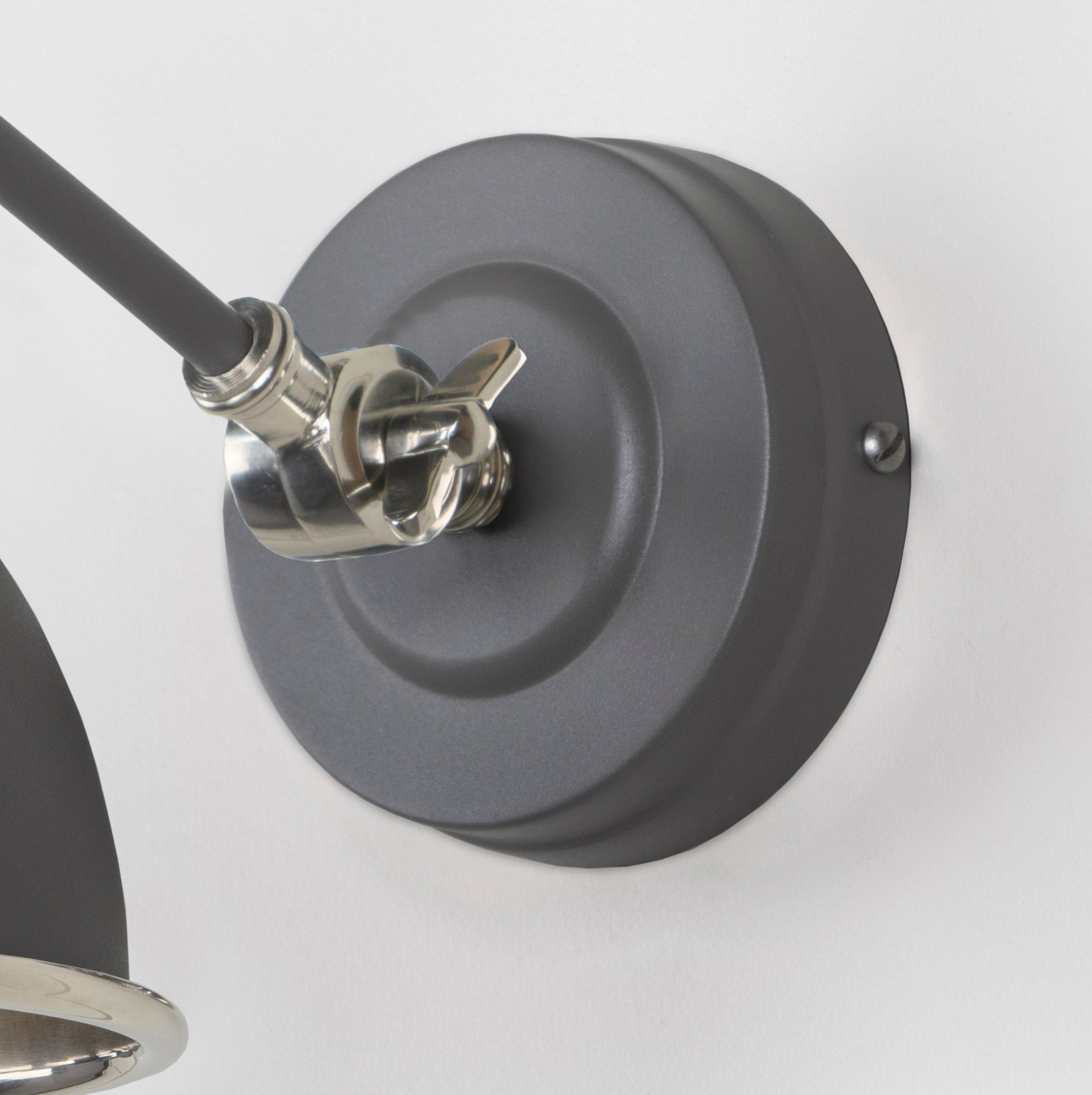 Smooth Nickel Brindley Wall Light Bluff, close up view of fitting and cable.