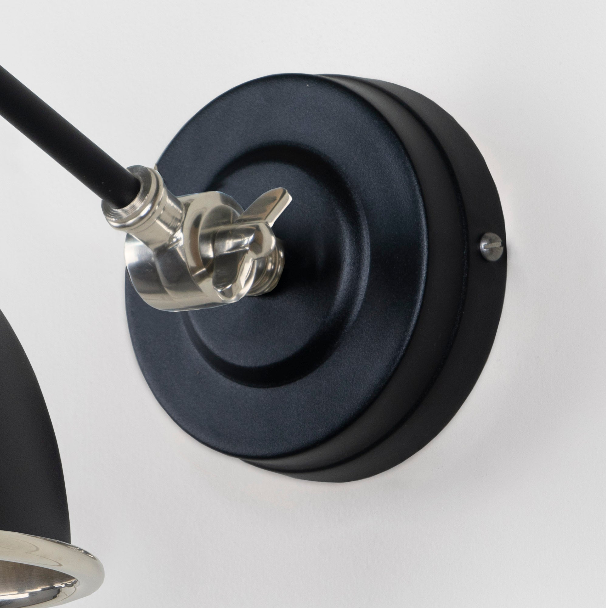 Smooth Nickel Brindley Wall Light Elan Black, close up view of fitting and cable.