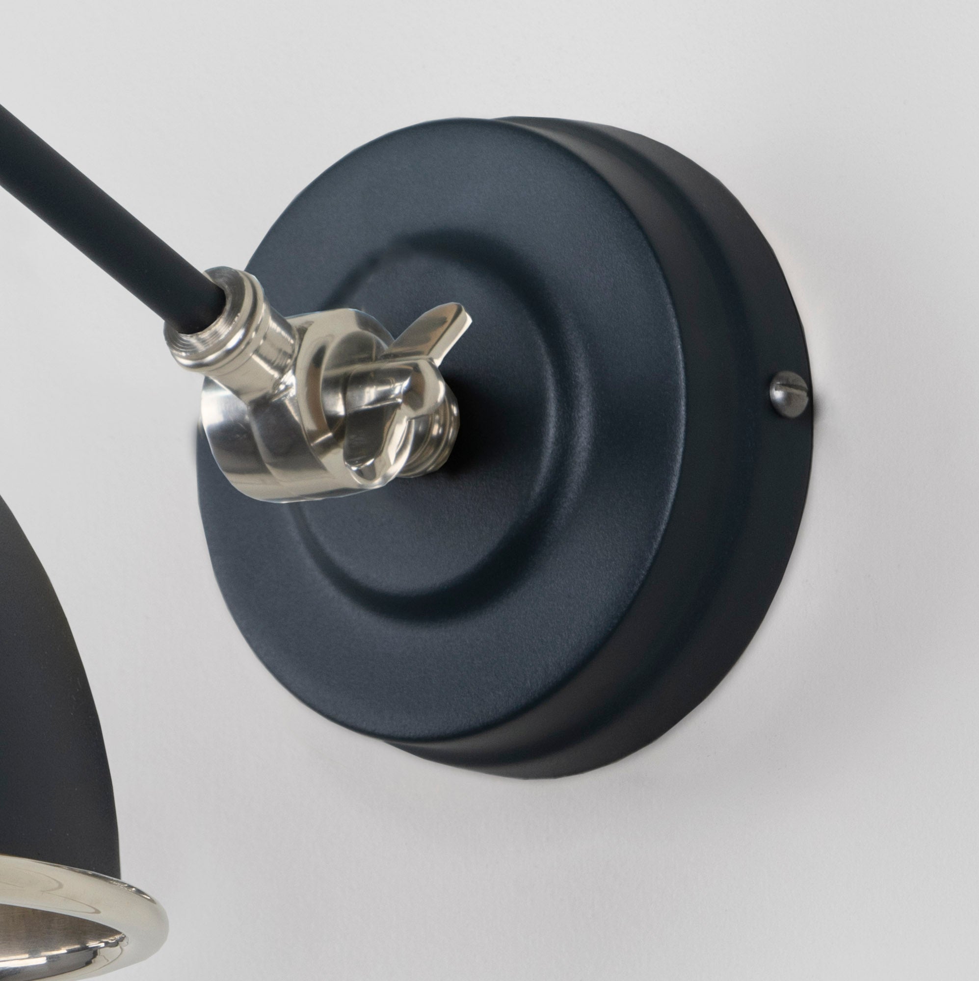 Smooth Nickel Brindley Wall Light Soot, close up view of fitting and cable.